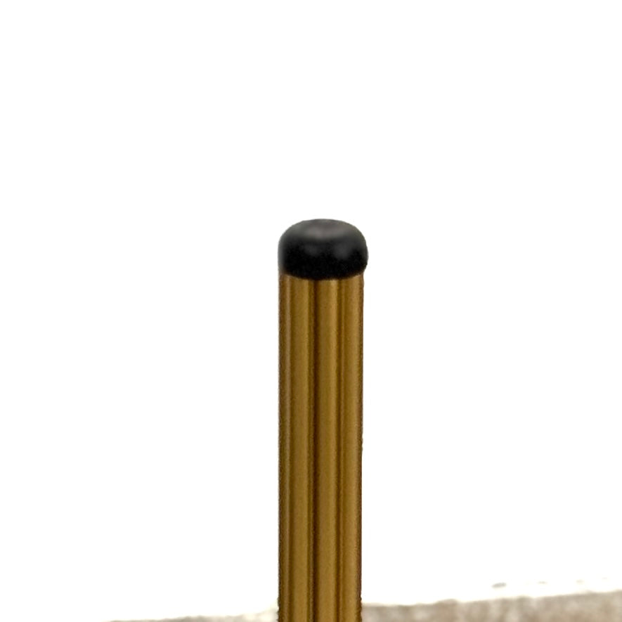 The Pedrali Blume Side Table features a round top and elegant gold legs, offering a stylish addition to any room.