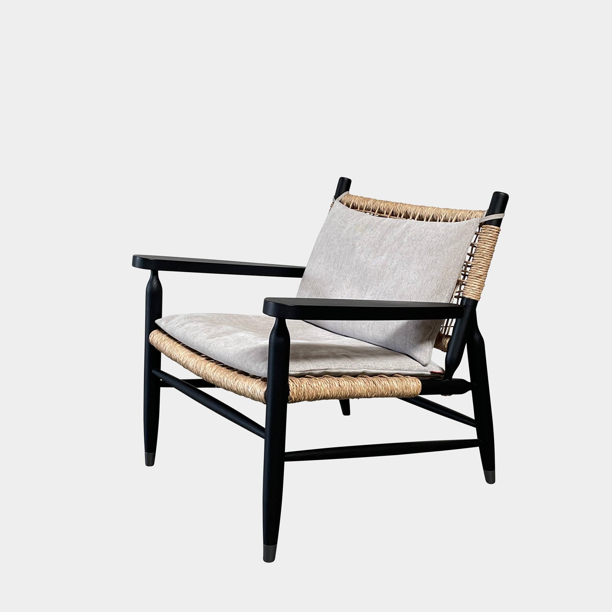 Two hand-crafted Flexform Tessa Lounge Chairs with black frames and neutral-tone cushions on a white background.