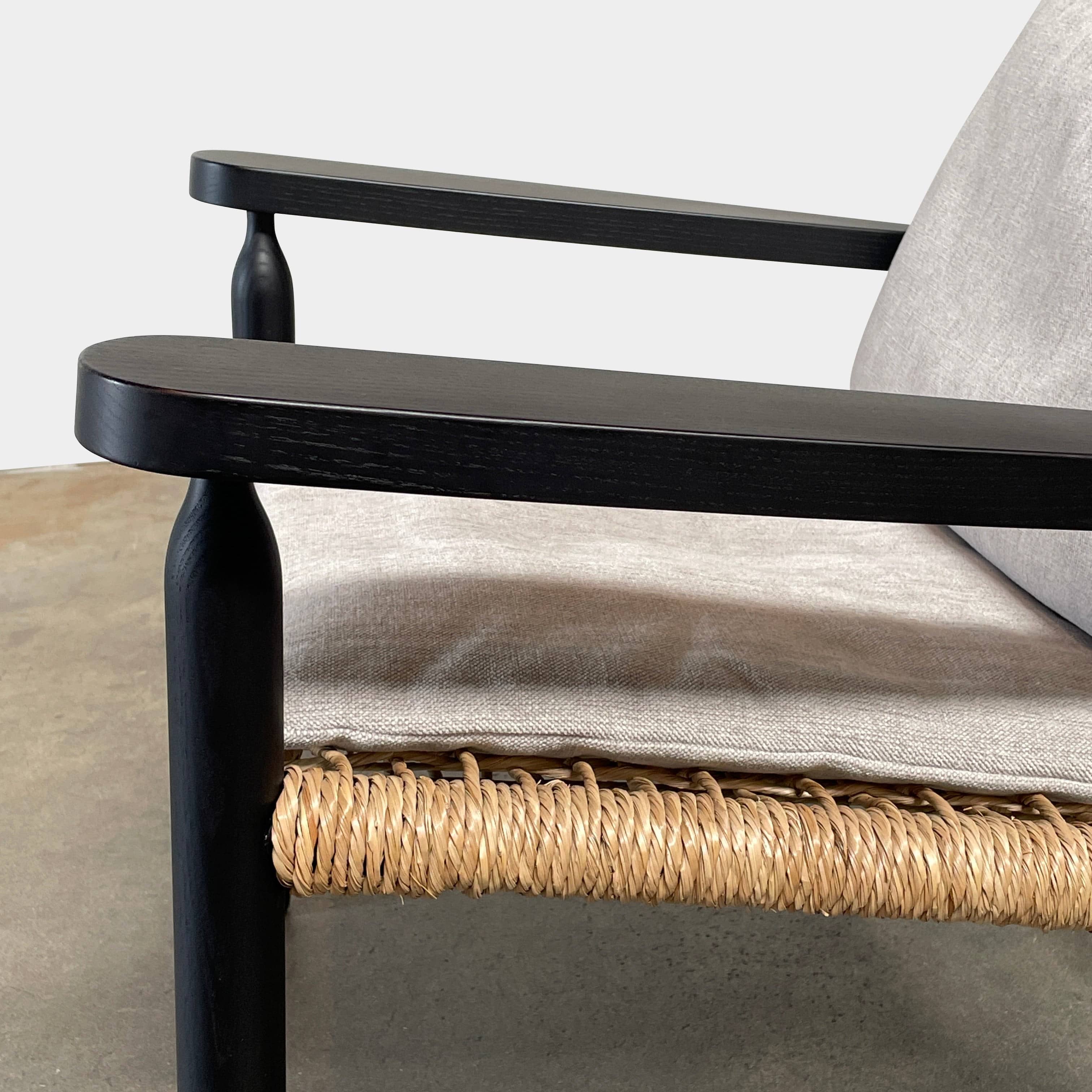 Two hand-crafted Flexform Tessa Lounge Chairs with black frames and neutral-tone cushions on a white background.