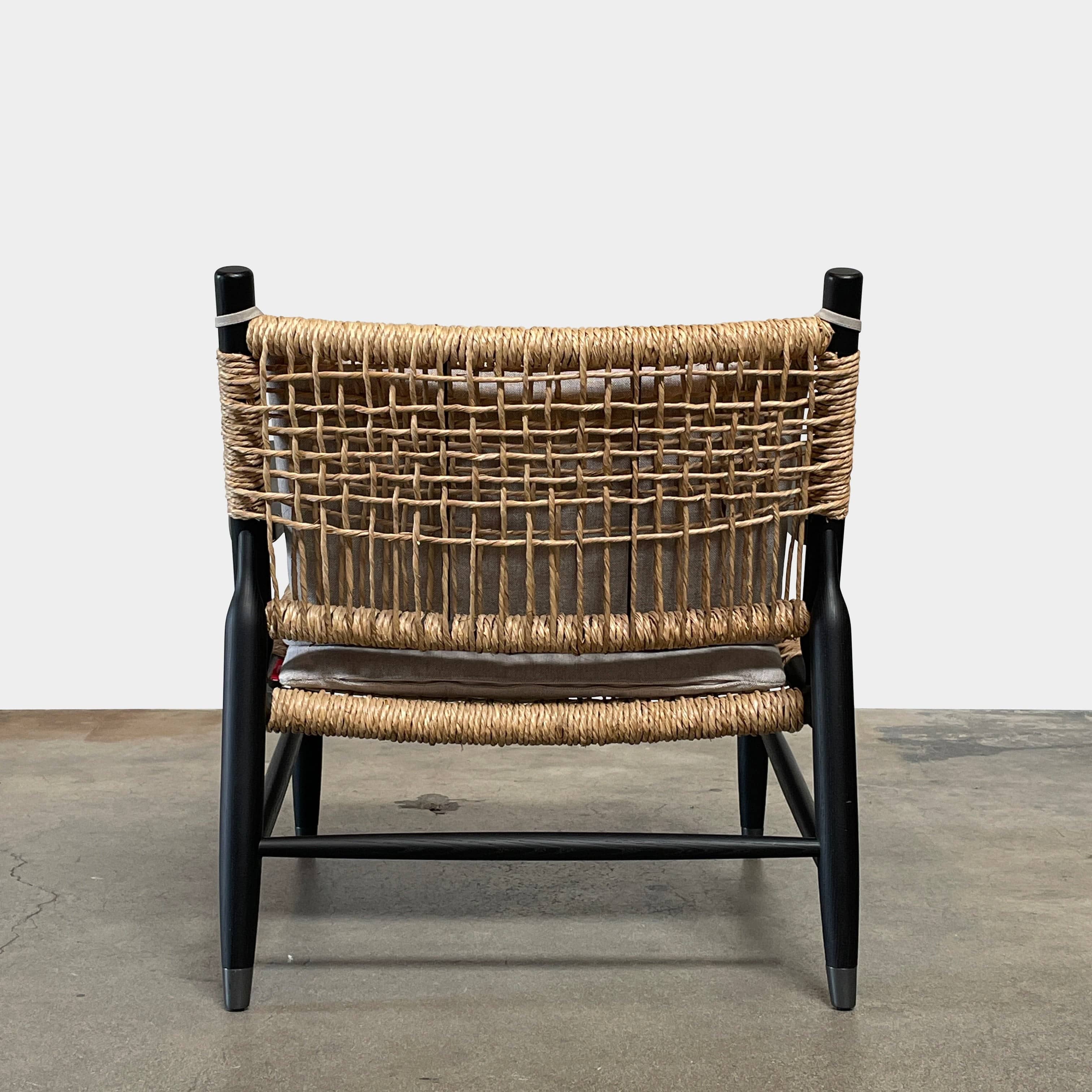 Two hand-crafted Flexform Tessa Lounge Chairs with black frames and neutral-tone cushions on a white background.