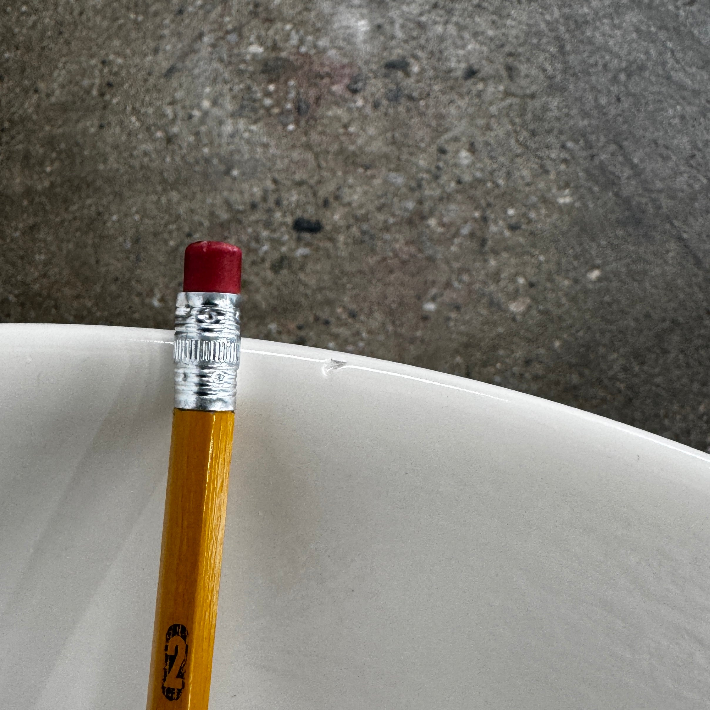 The Gervasoni Brise 43 Side Table by Gervasoni features a beige, cylindrical shape with a wide, subtly flared rim and a vertical seam, evoking Art Nouveau influences, shown against a plain white background.