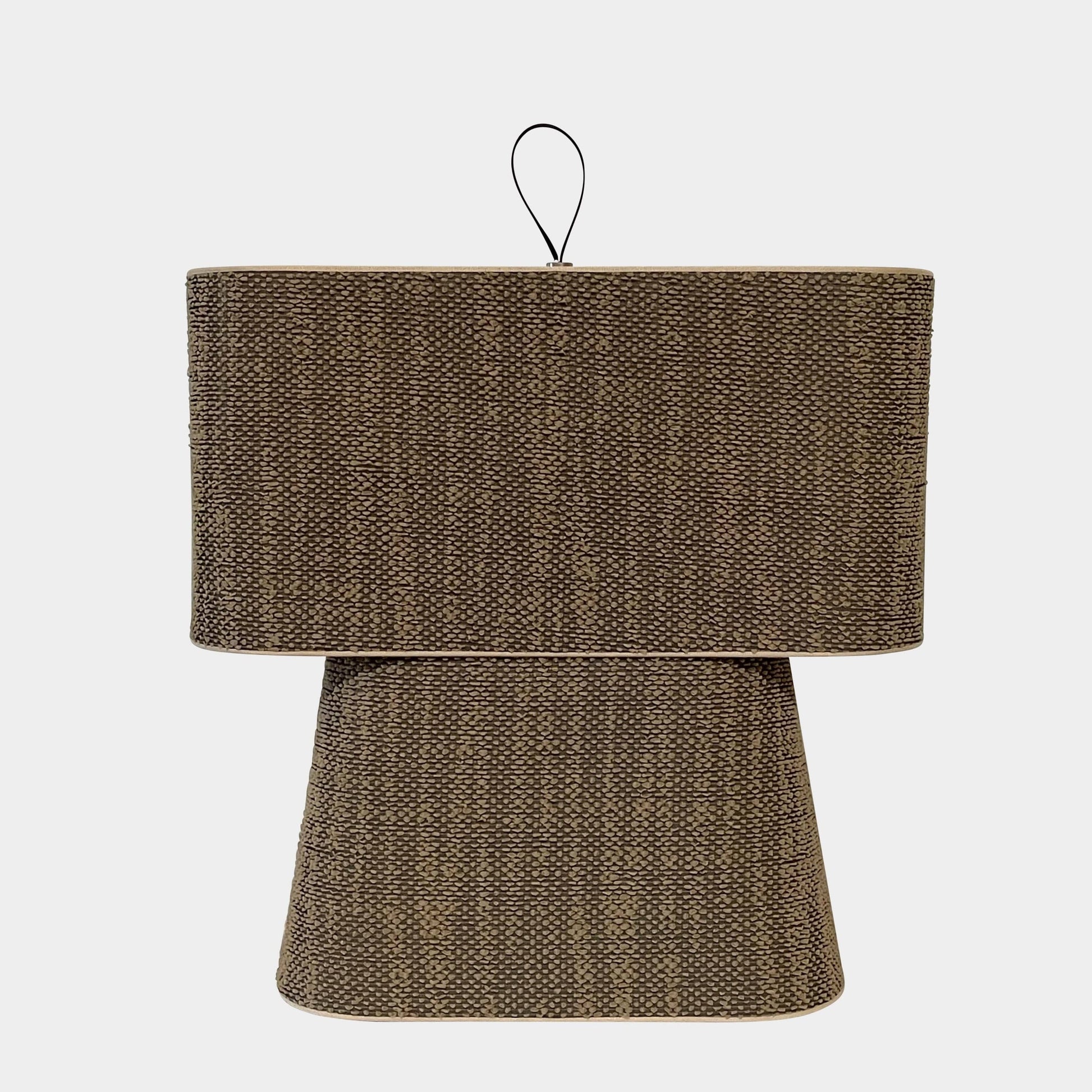 Two-tiered, textured fabric lampshade with a loop finial on a white background for the Luminara Dabliu Table Light by Luminara.