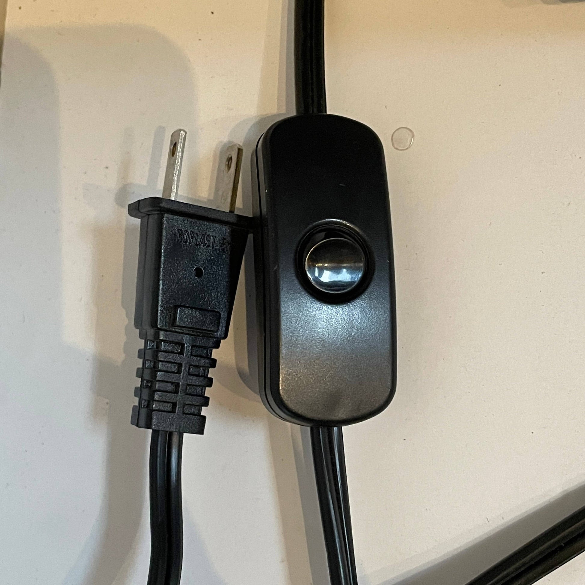 Two-tiered, textured fabric lampshade with a loop finial on a white background for the Luminara Dabliu Table Light by Luminara.