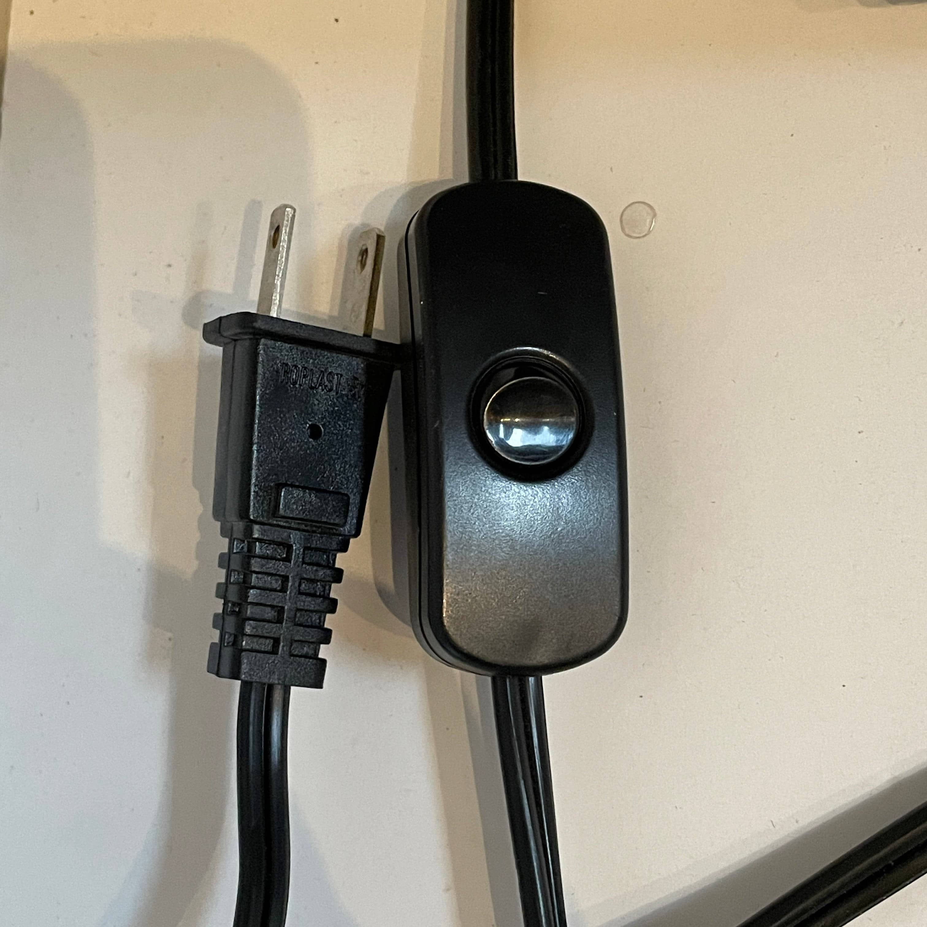 Two-tiered, textured fabric lampshade with a loop finial on a white background for the Luminara Dabliu Table Light by Luminara.