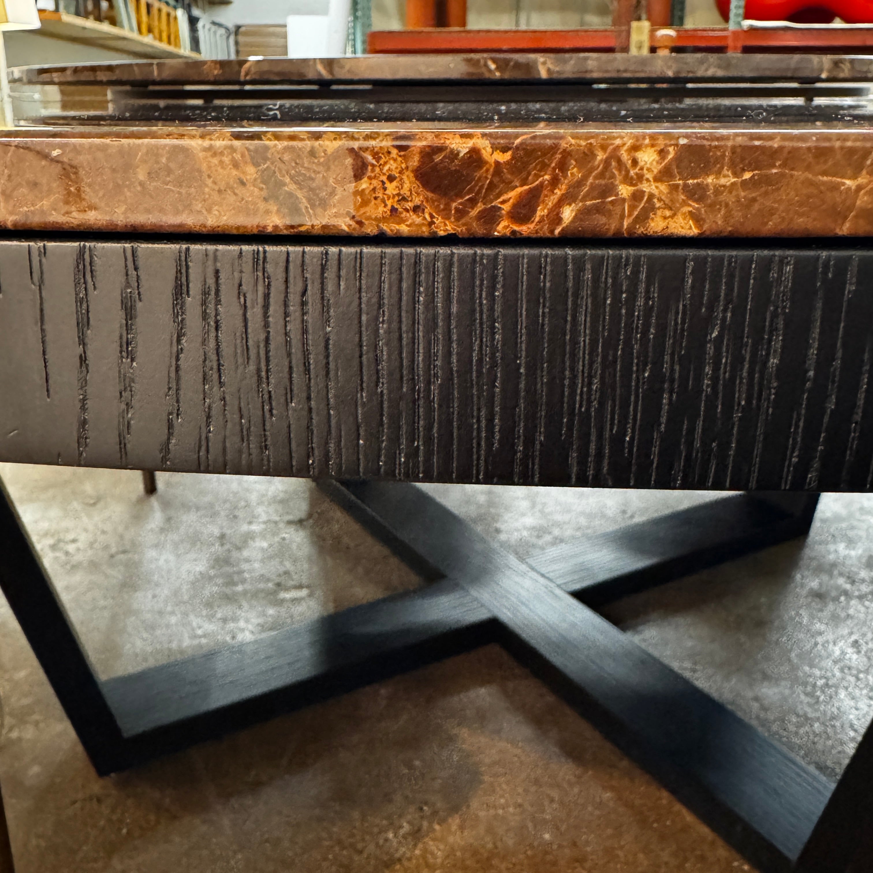 The Maxalto Xilos Dining Table with Rotating Tray by Maxalto features a round, dark finish and a black geometric base, shown here against a plain light background.