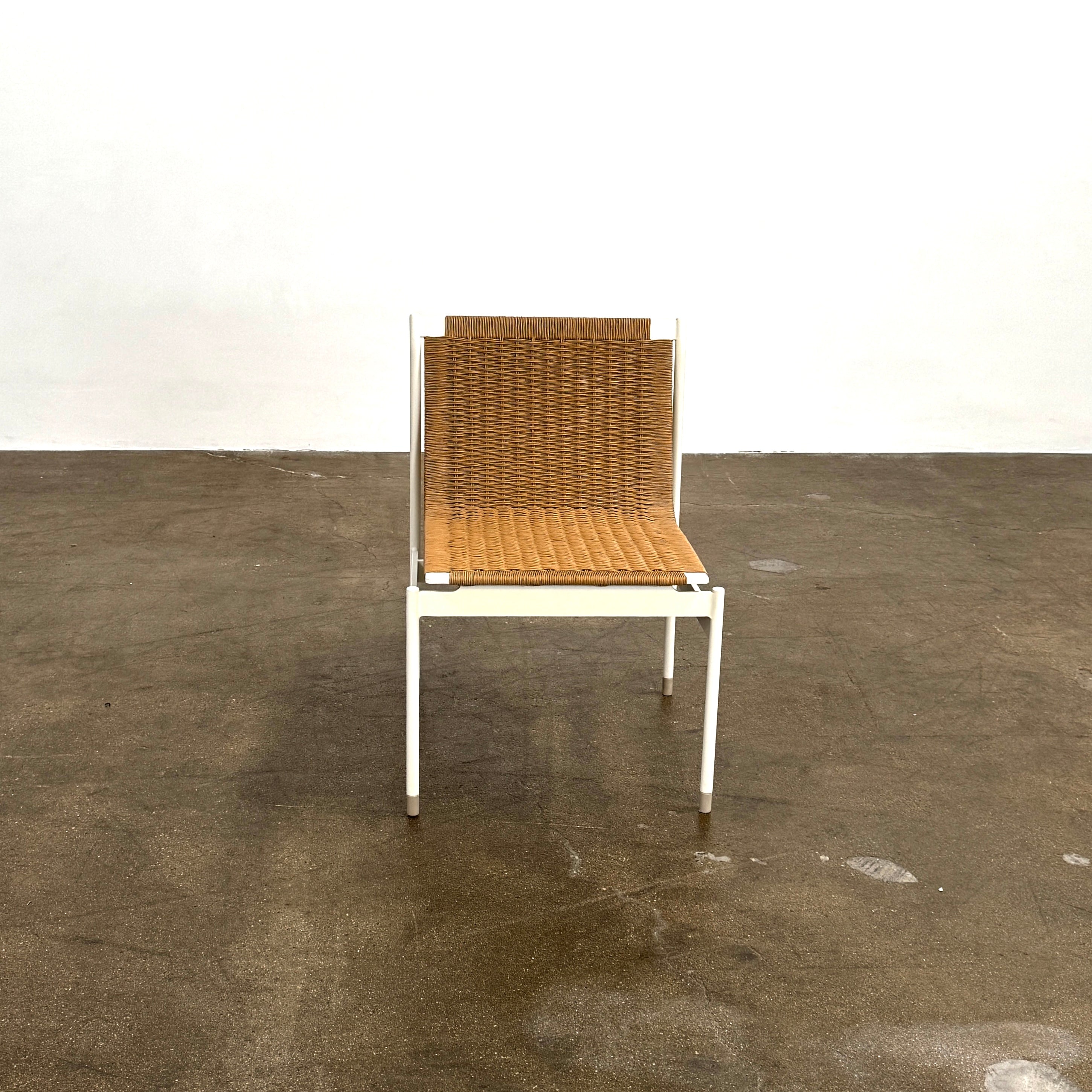 Nine MillerKnoll Sommer Outdoor Dining Chairs for DWR, sold in sets of 2, with metal frames and weatherproof wicker seats and backs, are arranged in three rows against a plain white background.