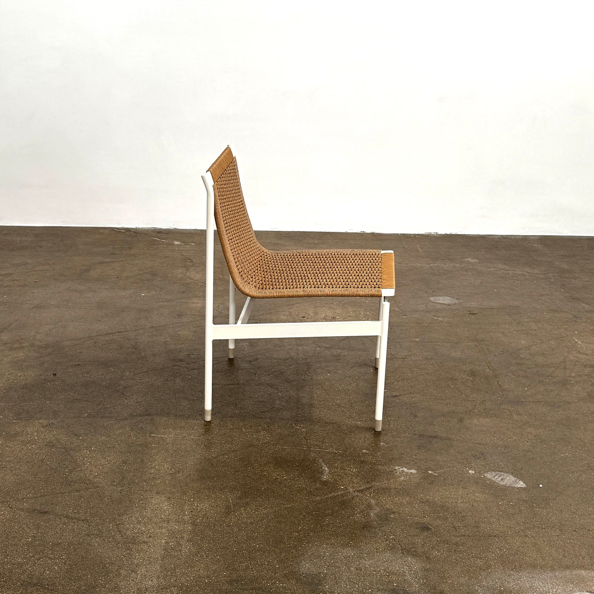 Nine MillerKnoll Sommer Outdoor Dining Chairs for DWR, sold in sets of 2, with metal frames and weatherproof wicker seats and backs, are arranged in three rows against a plain white background.