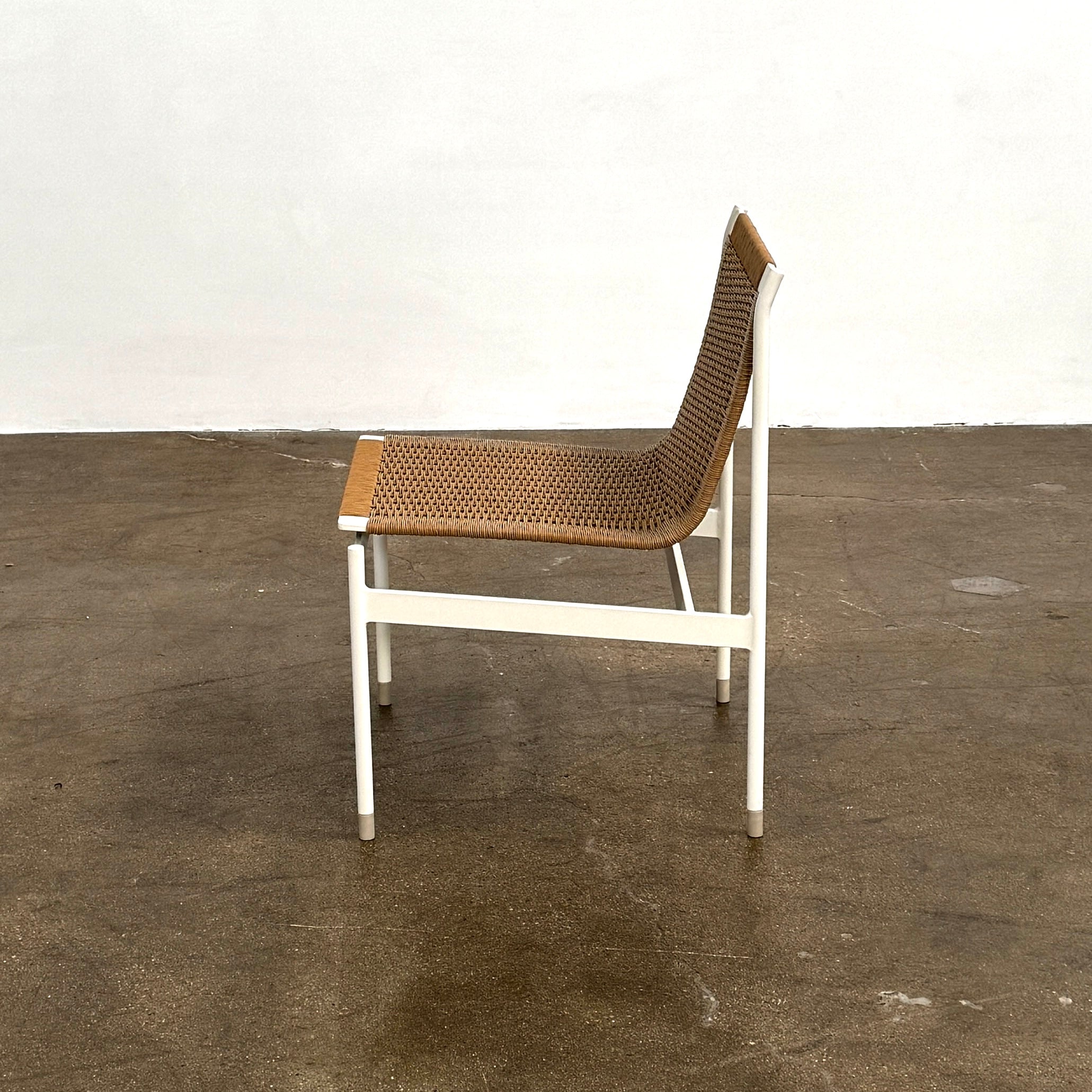 Nine MillerKnoll Sommer Outdoor Dining Chairs for DWR, sold in sets of 2, with metal frames and weatherproof wicker seats and backs, are arranged in three rows against a plain white background.