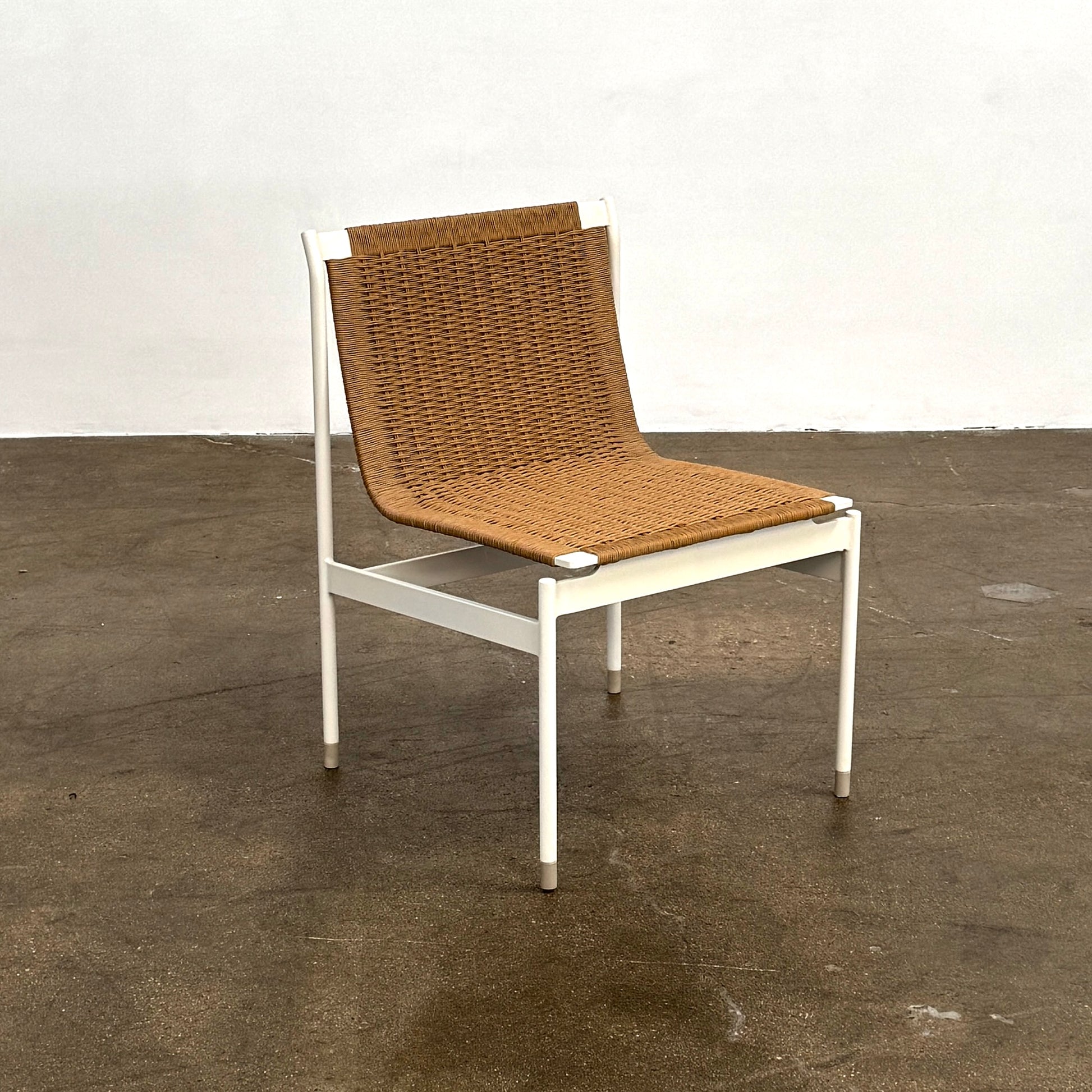 Nine MillerKnoll Sommer Outdoor Dining Chairs for DWR, sold in sets of 2, with metal frames and weatherproof wicker seats and backs, are arranged in three rows against a plain white background.