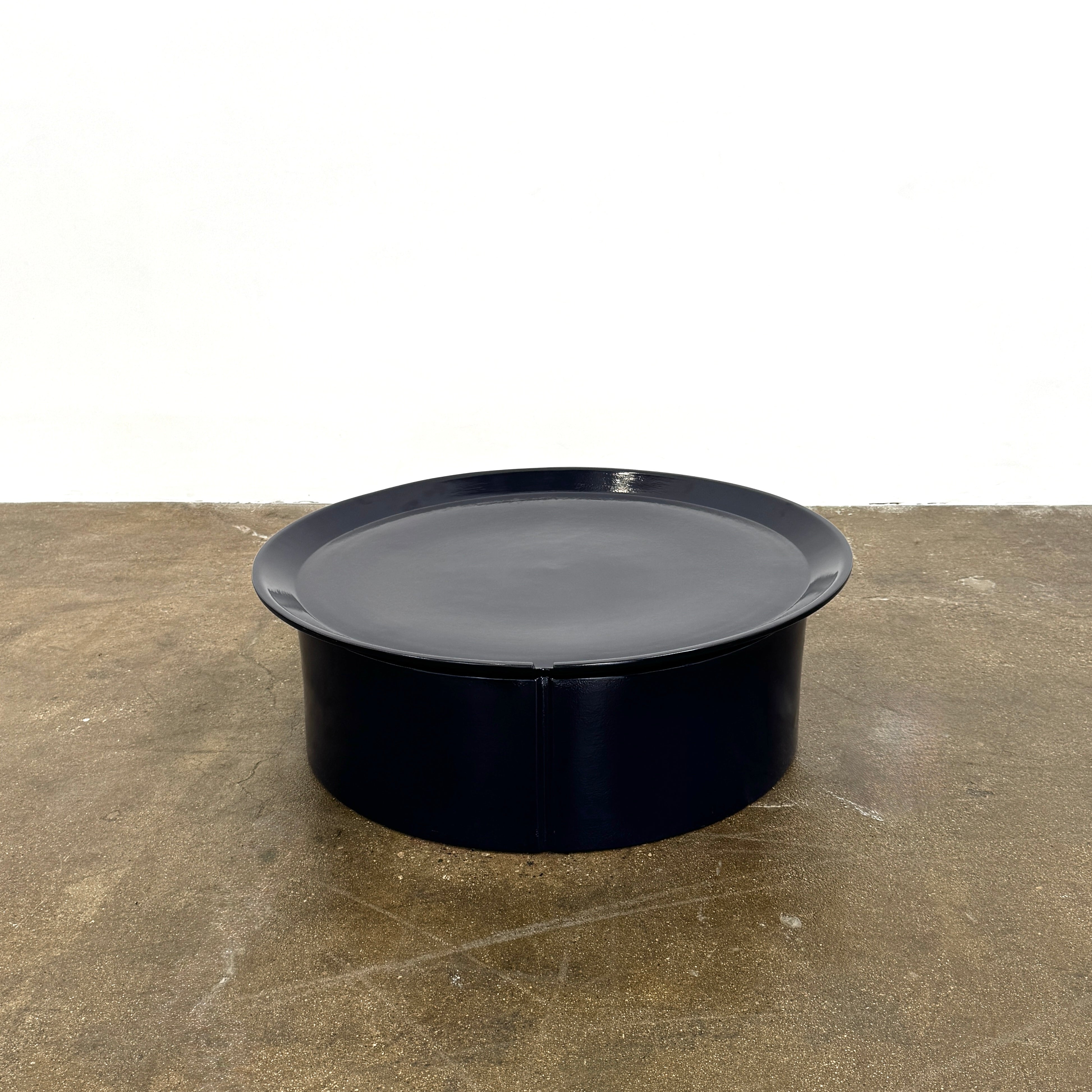 A round black plastic tray with tall sides and a smooth surface, shown on a white background—an ideal accessory for the Modern Resale Gervasoni Brise 46 Outdoor Coffee Table or other Art Nouveau outdoor pieces.