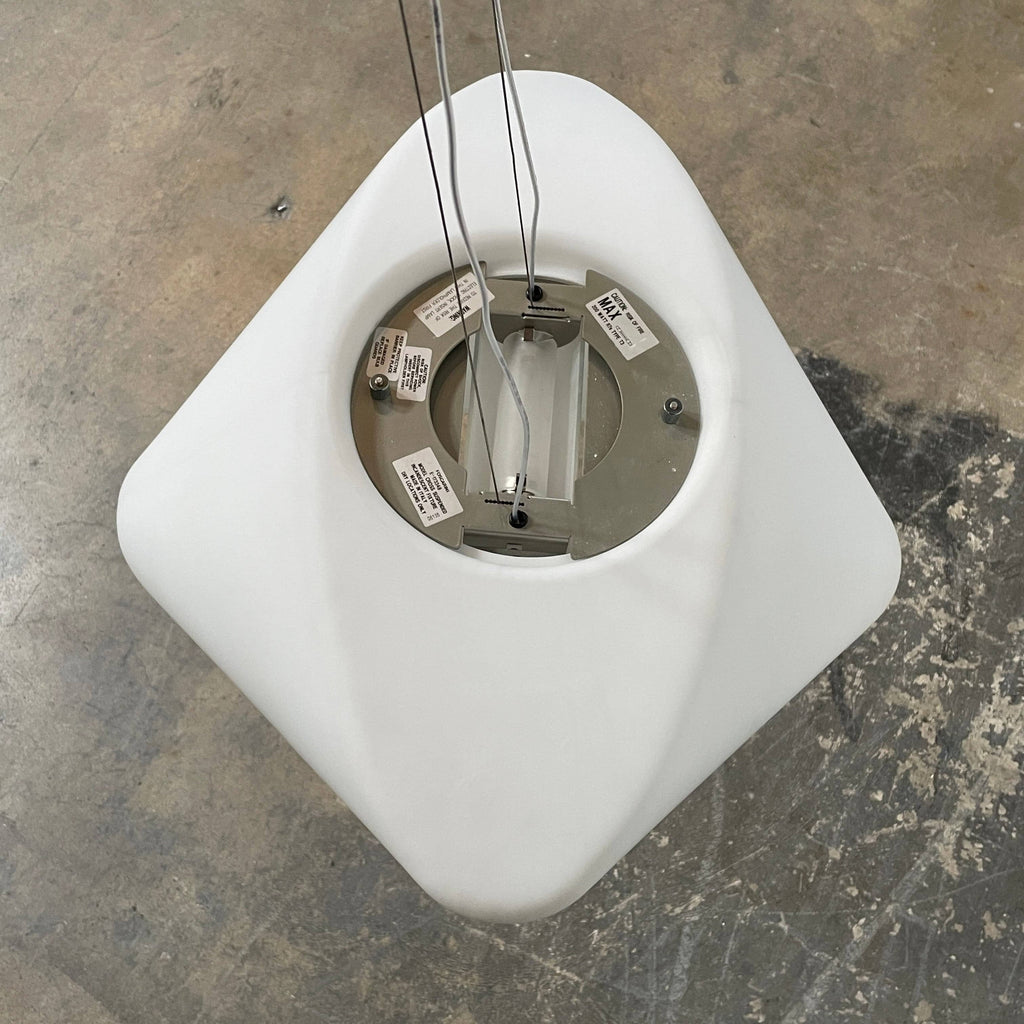 A modern Foscarini Cross Ceiling Light with a minimalist white shade suspended from the ceiling by two wires against a white background.