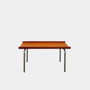 The Cappellini Side Table by Cappellini features stained beechwood, a raised back edge, and four chromed steel legs, shown against a plain white background.