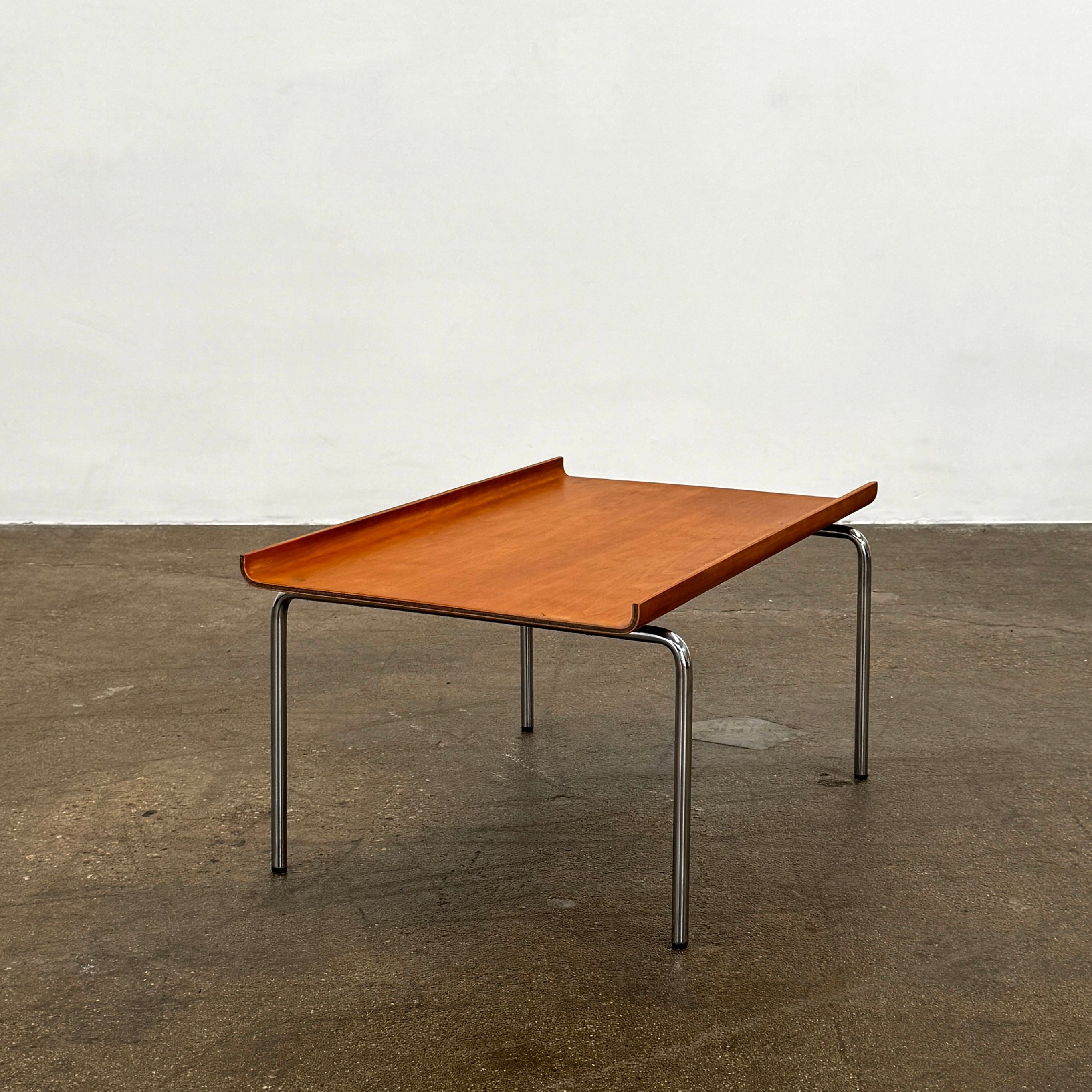 The Cappellini Side Table by Cappellini features stained beechwood, a raised back edge, and four chromed steel legs, shown against a plain white background.