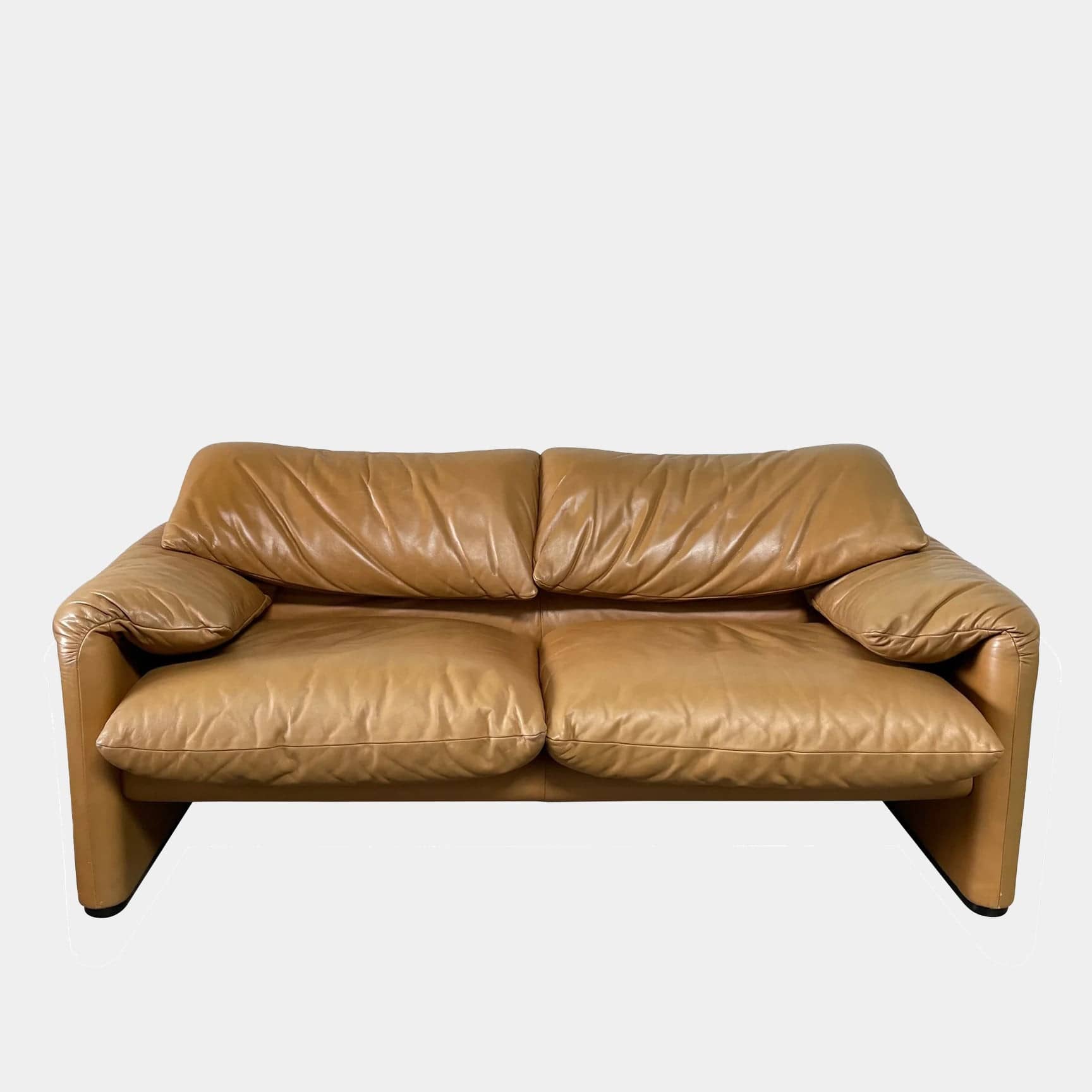 A Cassina Maralunga Two Seater sofa on a white background.