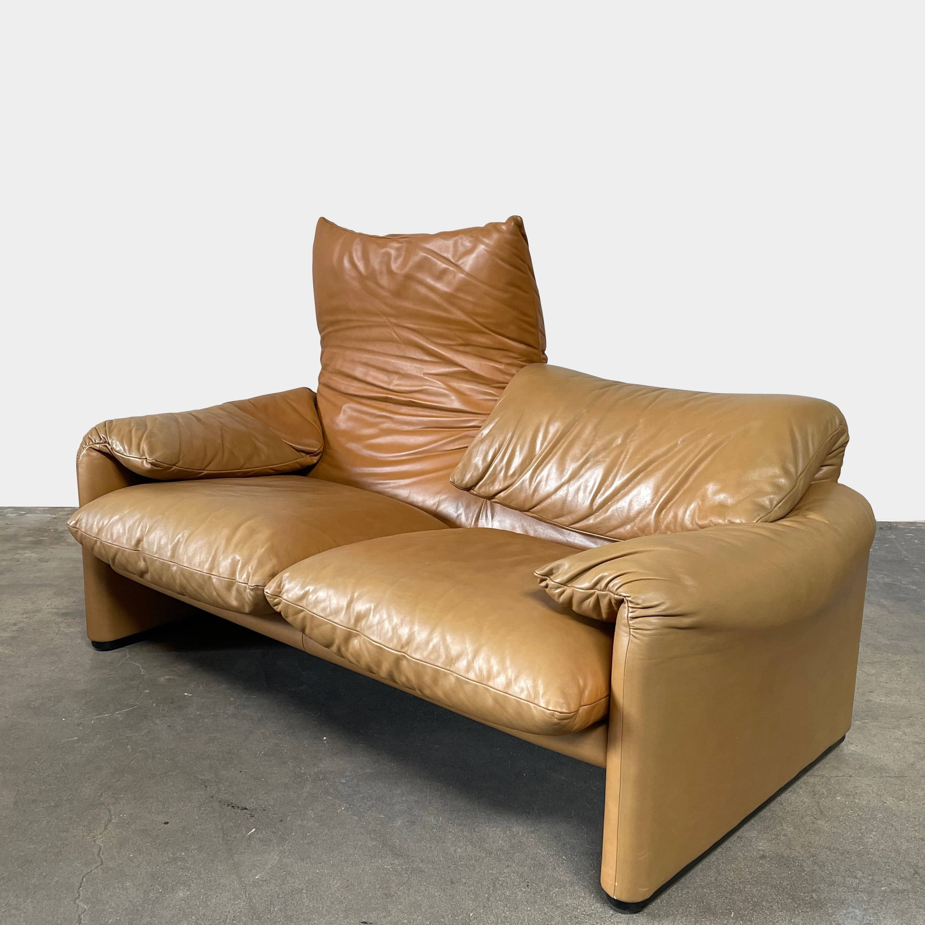 A Cassina Maralunga Two Seater sofa on a white background.