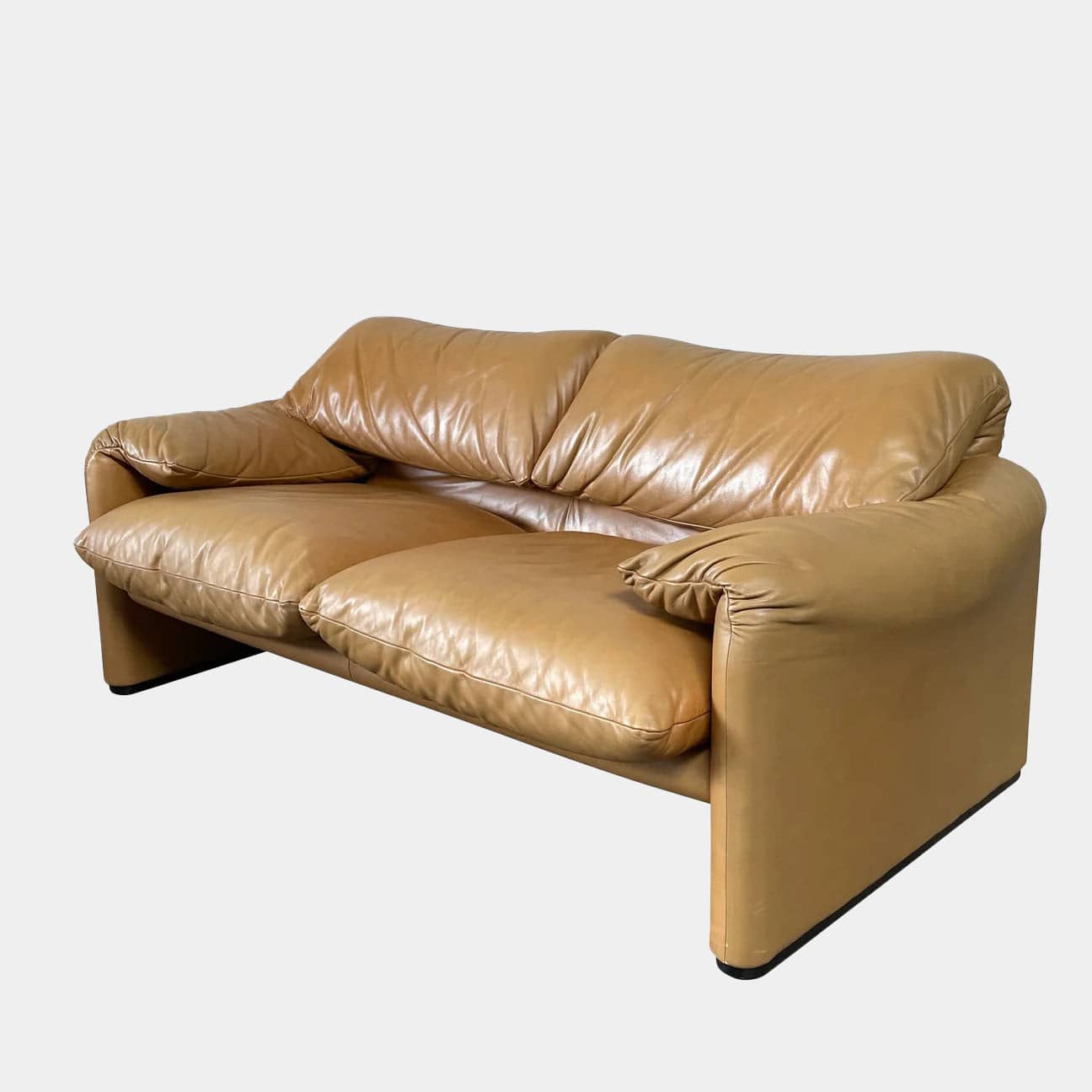 A Cassina Maralunga Two Seater sofa on a white background.
