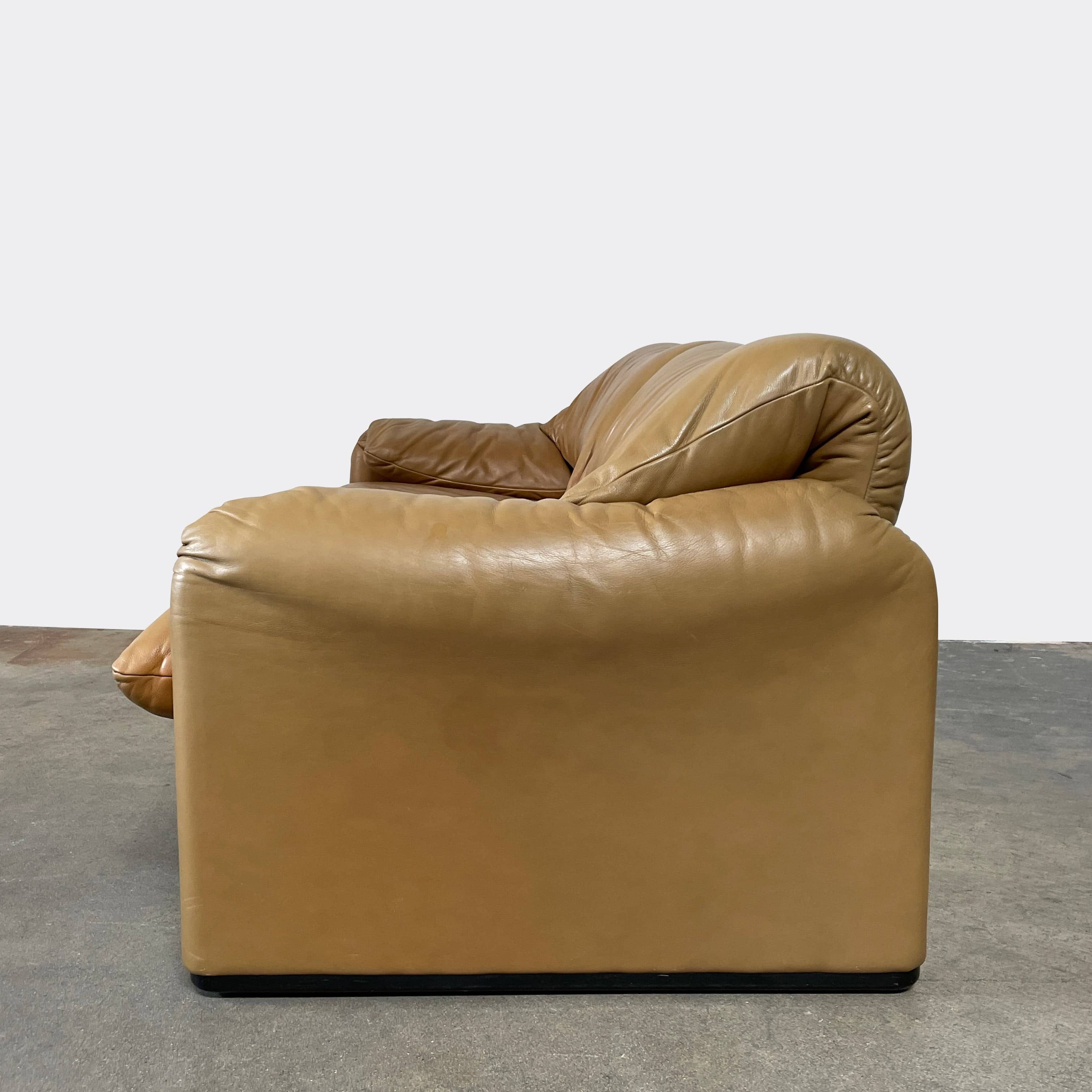 A Cassina Maralunga Two Seater sofa on a white background.