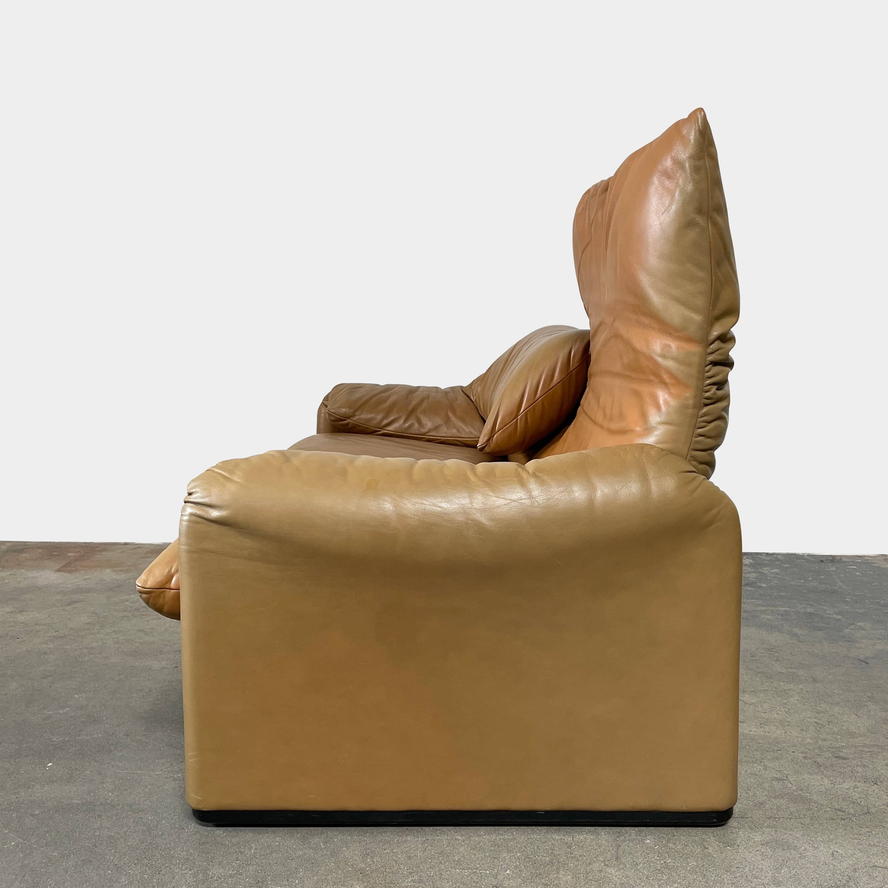 A Cassina Maralunga Two Seater sofa on a white background.