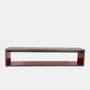 The B&B Italia Frank Low Console Table by B&B Italia features a rectangular, low-profile design with an open base and red interior shelf, shown against a plain white background.