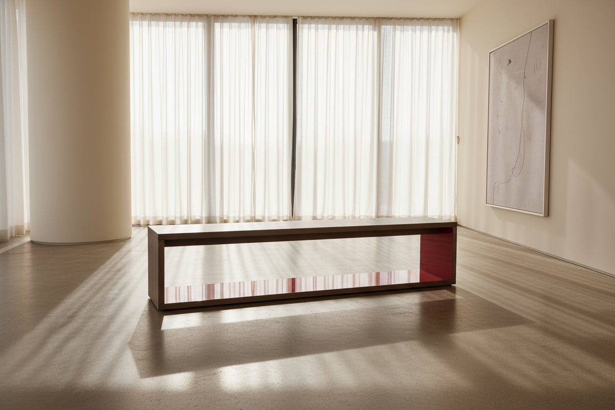 The B&B Italia Frank Low Console Table by B&B Italia features a rectangular, low-profile design with an open base and red interior shelf, shown against a plain white background.