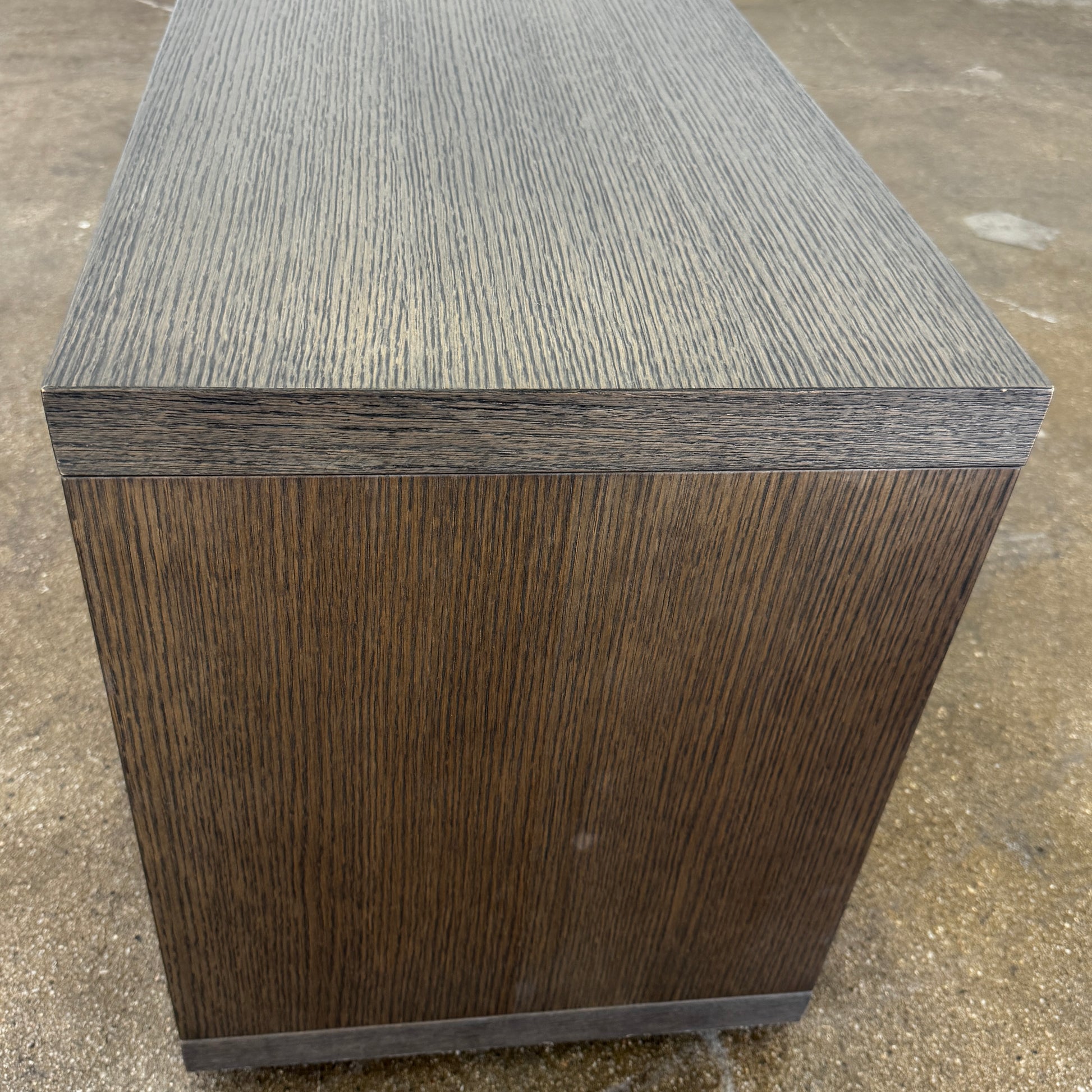 The B&B Italia Frank Low Console Table by B&B Italia features a rectangular, low-profile design with an open base and red interior shelf, shown against a plain white background.