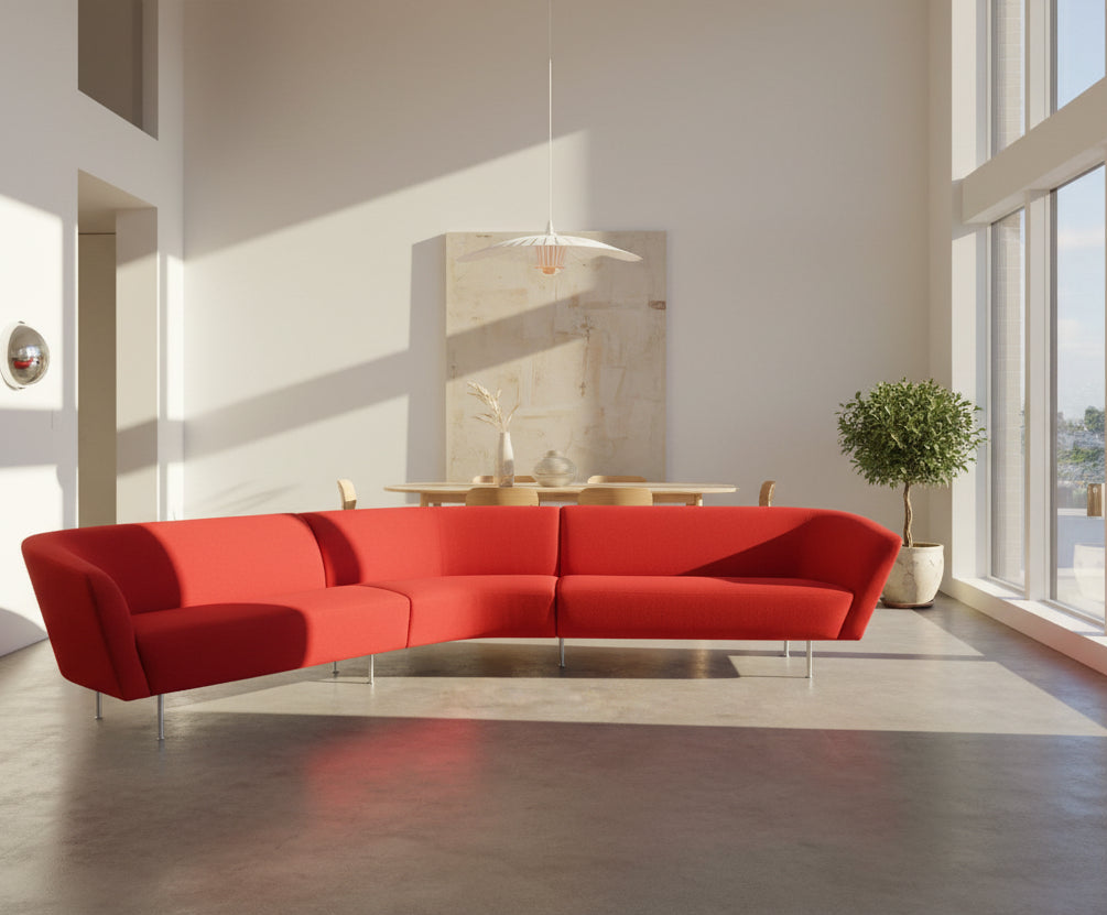 The Arper Loop Modular Sofa by Arper features a modern curved design with a geometric profile and metal legs, shown at an angle against a plain white background.