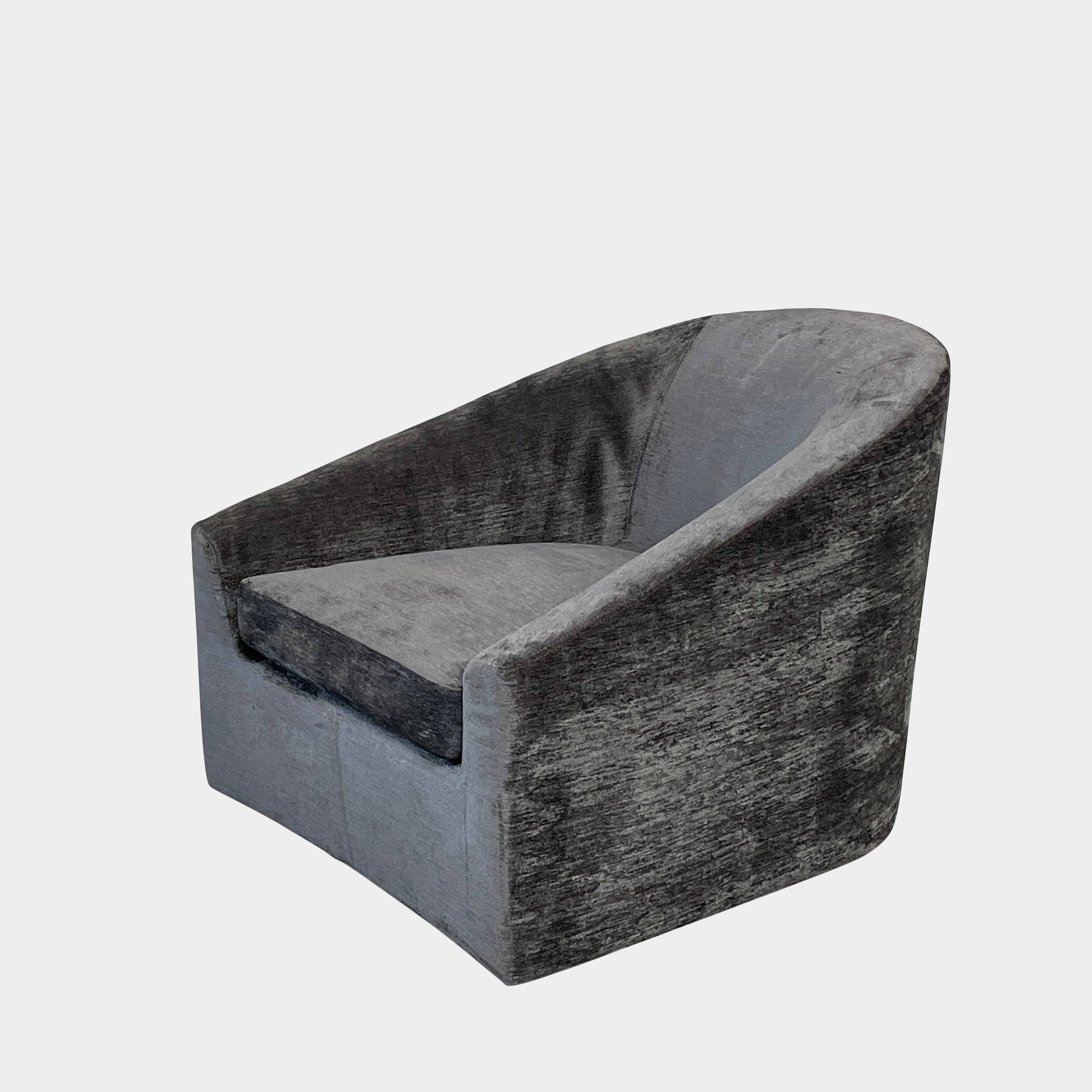 The Minotti Quinn Swivel Lounge Chair Set of 2 showcases a minimalist design with dark gray, curved forms in luxurious chenille. Ideal for the living room, these modern chairs stand out against a light gray backdrop.