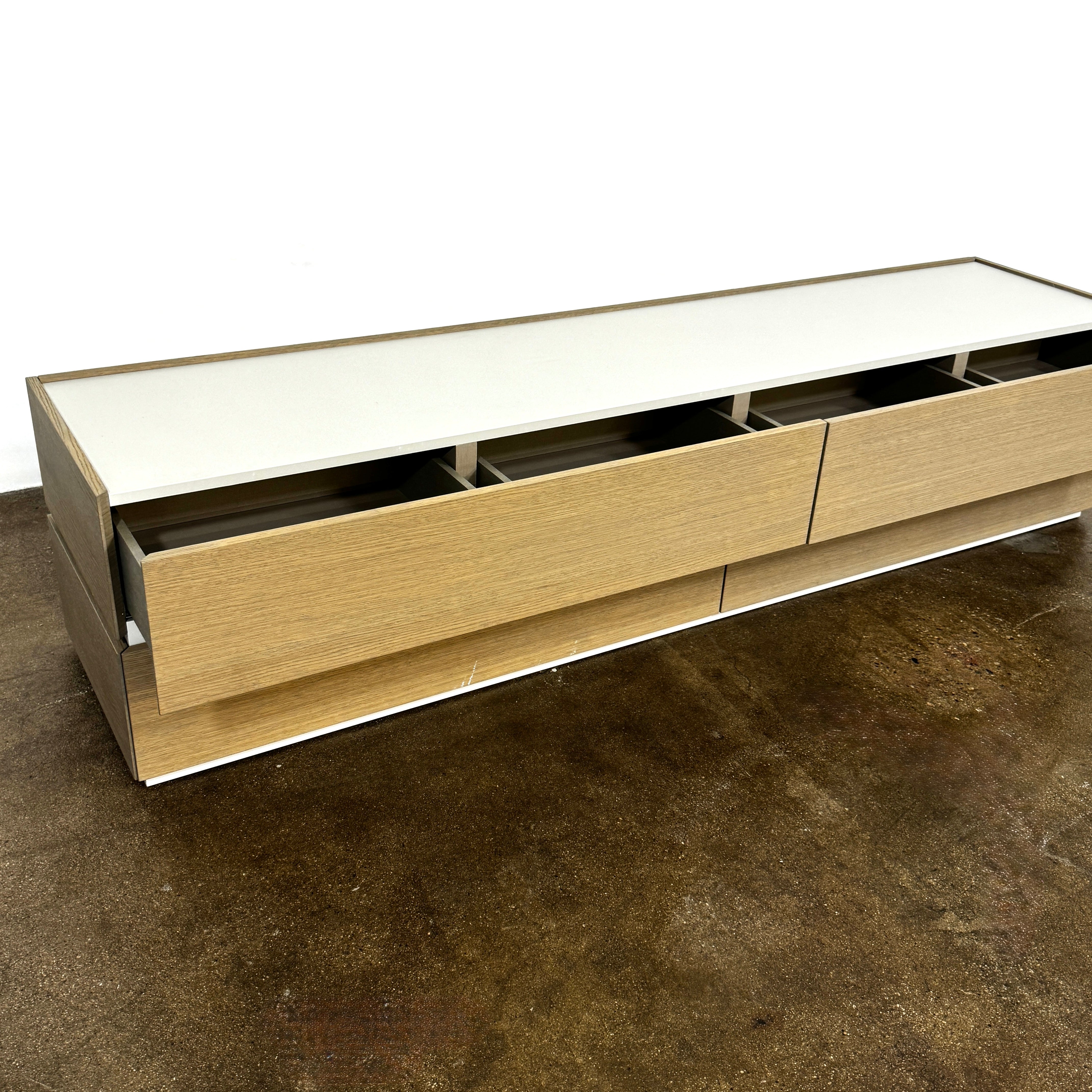 A rectangular wooden coffin with a simple, modern design and light wood finish, featuring clean lines inspired by the Sangiacomo Cidori Chest of Drawers by Sangiacomo, shown from the front against a white background.