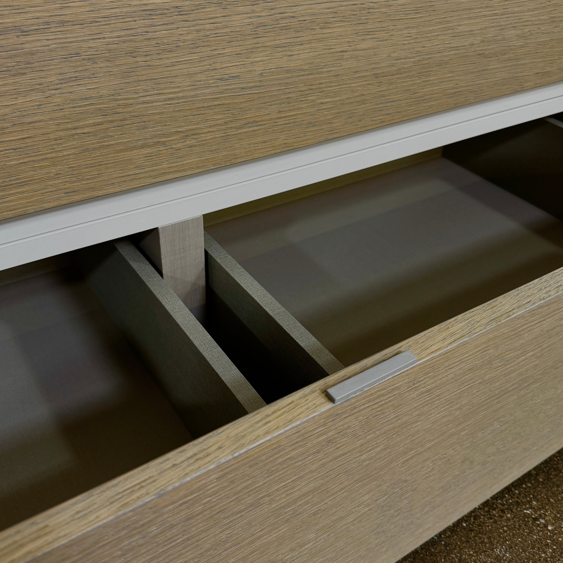 A rectangular wooden coffin with a simple, modern design and light wood finish, featuring clean lines inspired by the Sangiacomo Cidori Chest of Drawers by Sangiacomo, shown from the front against a white background.