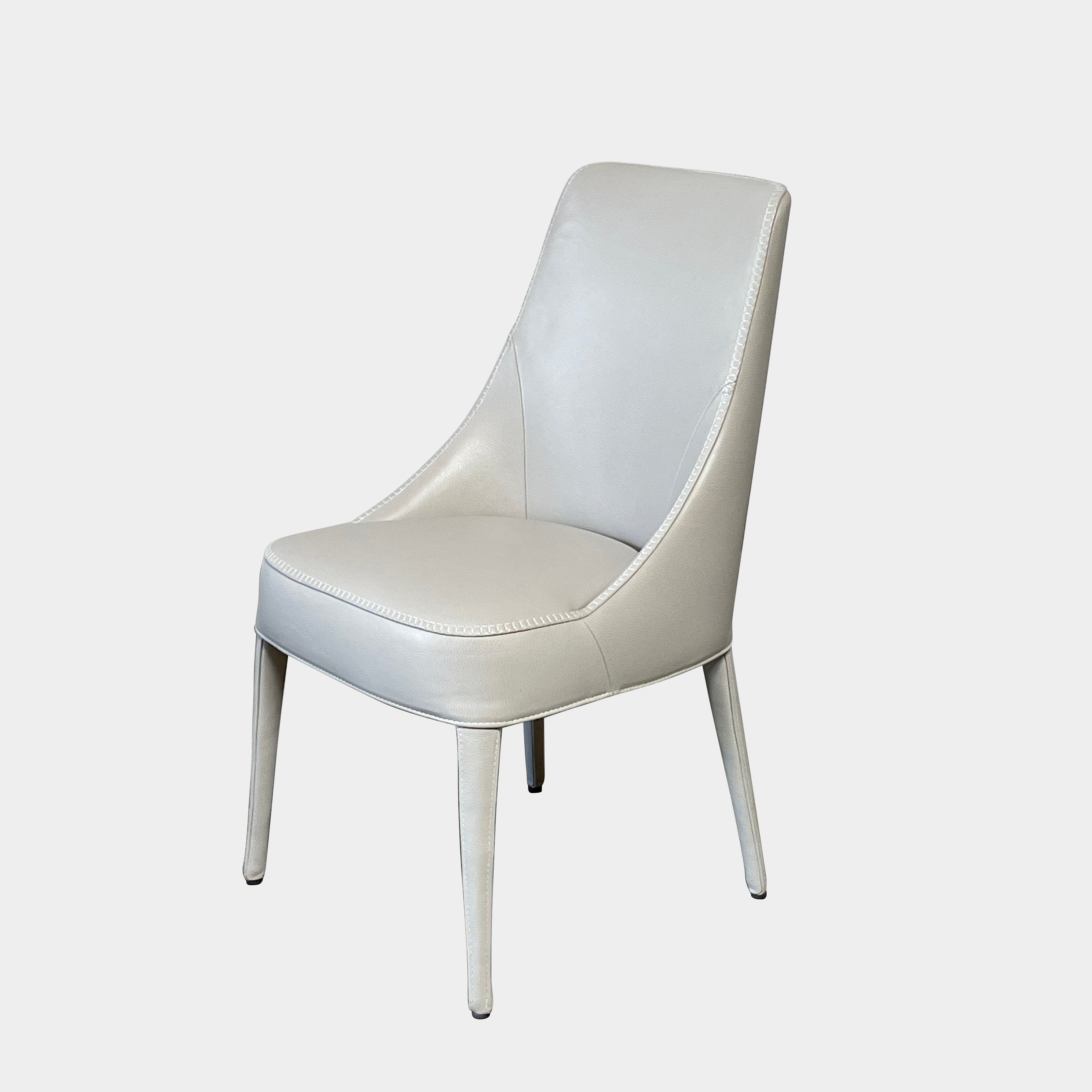 Two modern light gray Maxalto Febo high back dining chairs, embodying Italian design, against a white background.