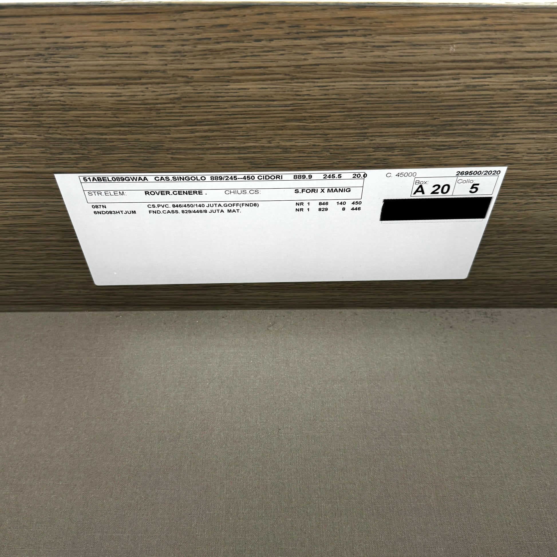 The Sangiacomo Cidori Small Chest of Drawers by Sangiacomo is ideal for contemporary spaces, featuring a light-toned top and single partially open drawer, set on a concrete floor against a white wall.