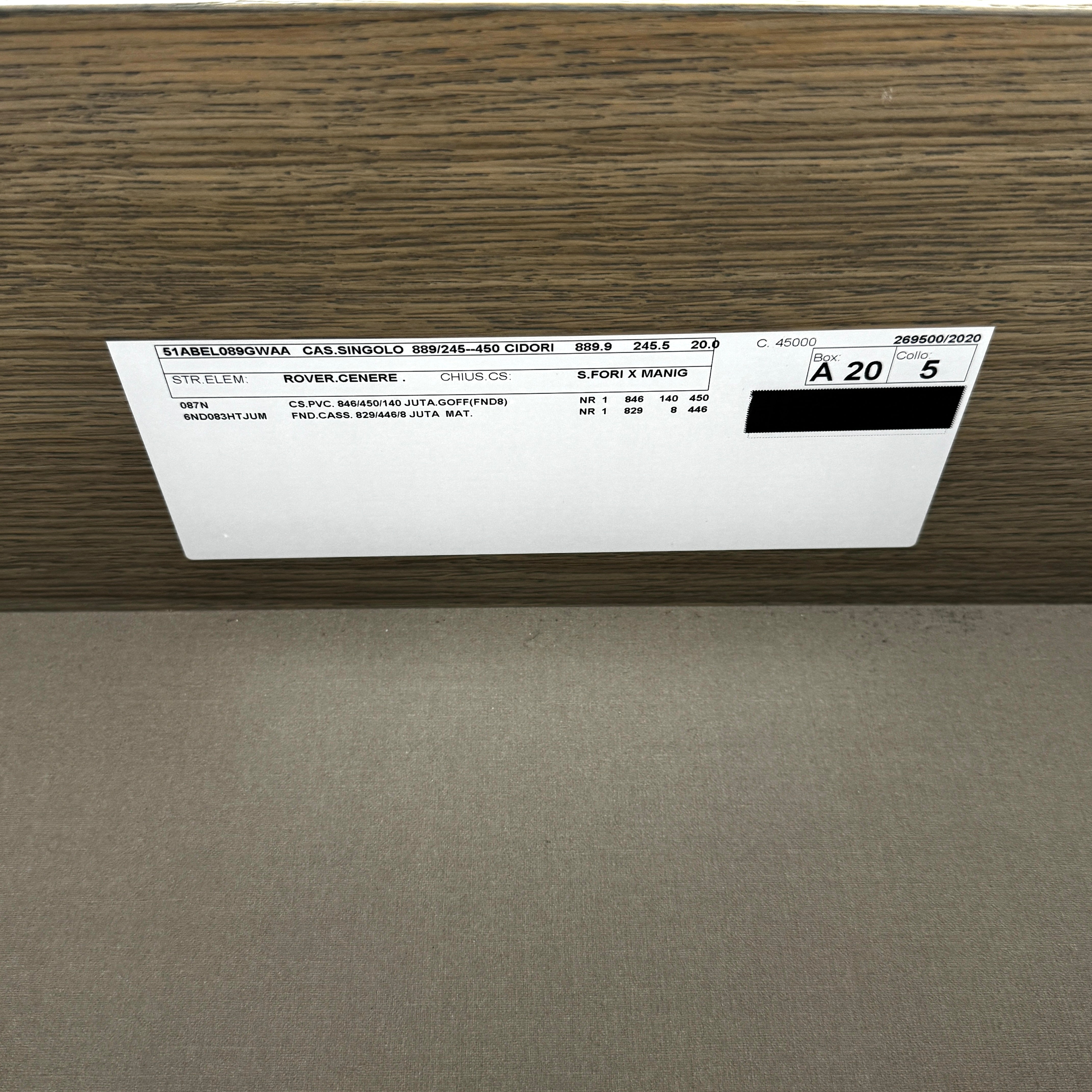 The Sangiacomo Cidori Small Chest of Drawers by Sangiacomo is ideal for contemporary spaces, featuring a light-toned top and single partially open drawer, set on a concrete floor against a white wall.