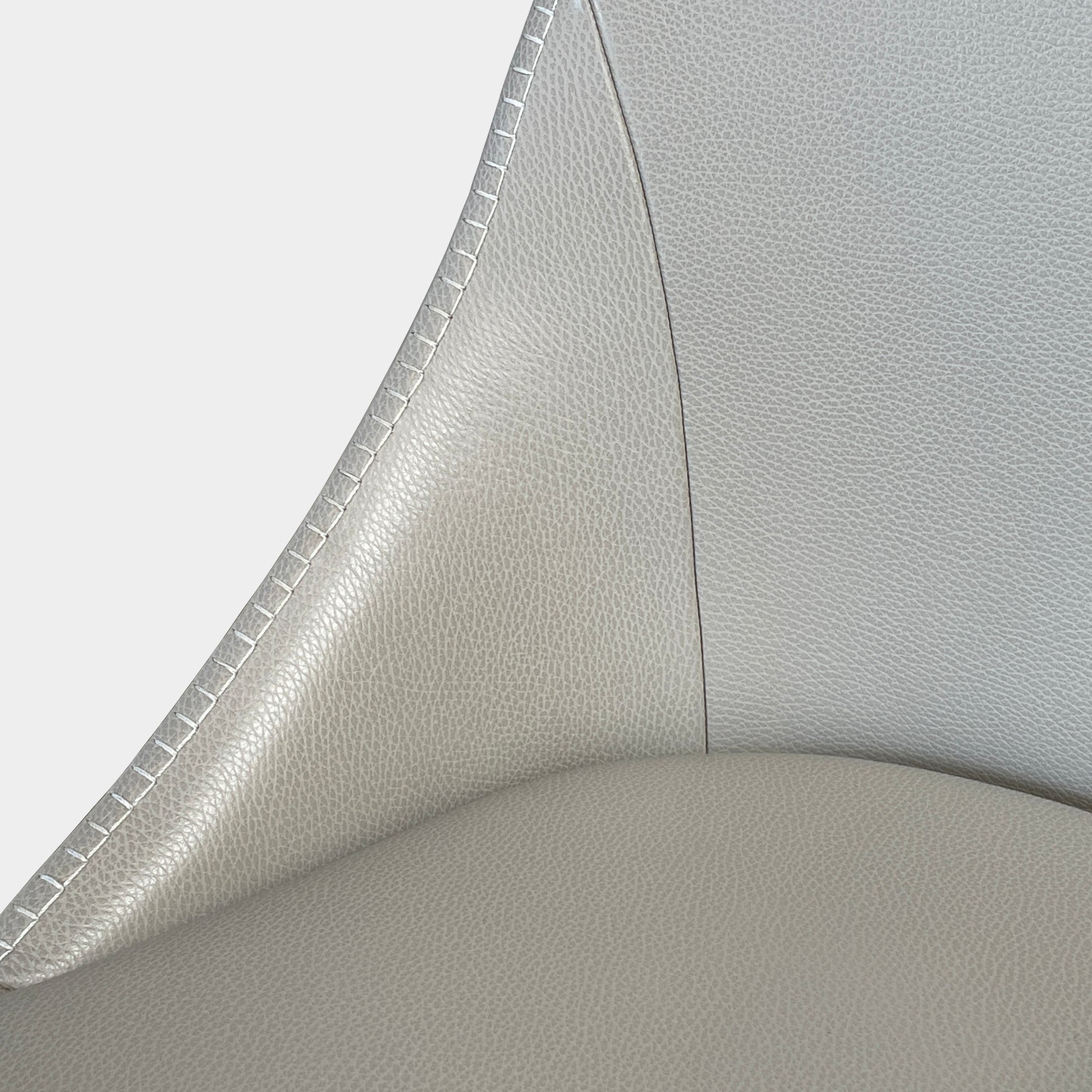 Two modern light gray Maxalto Febo high back dining chairs, embodying Italian design, against a white background.