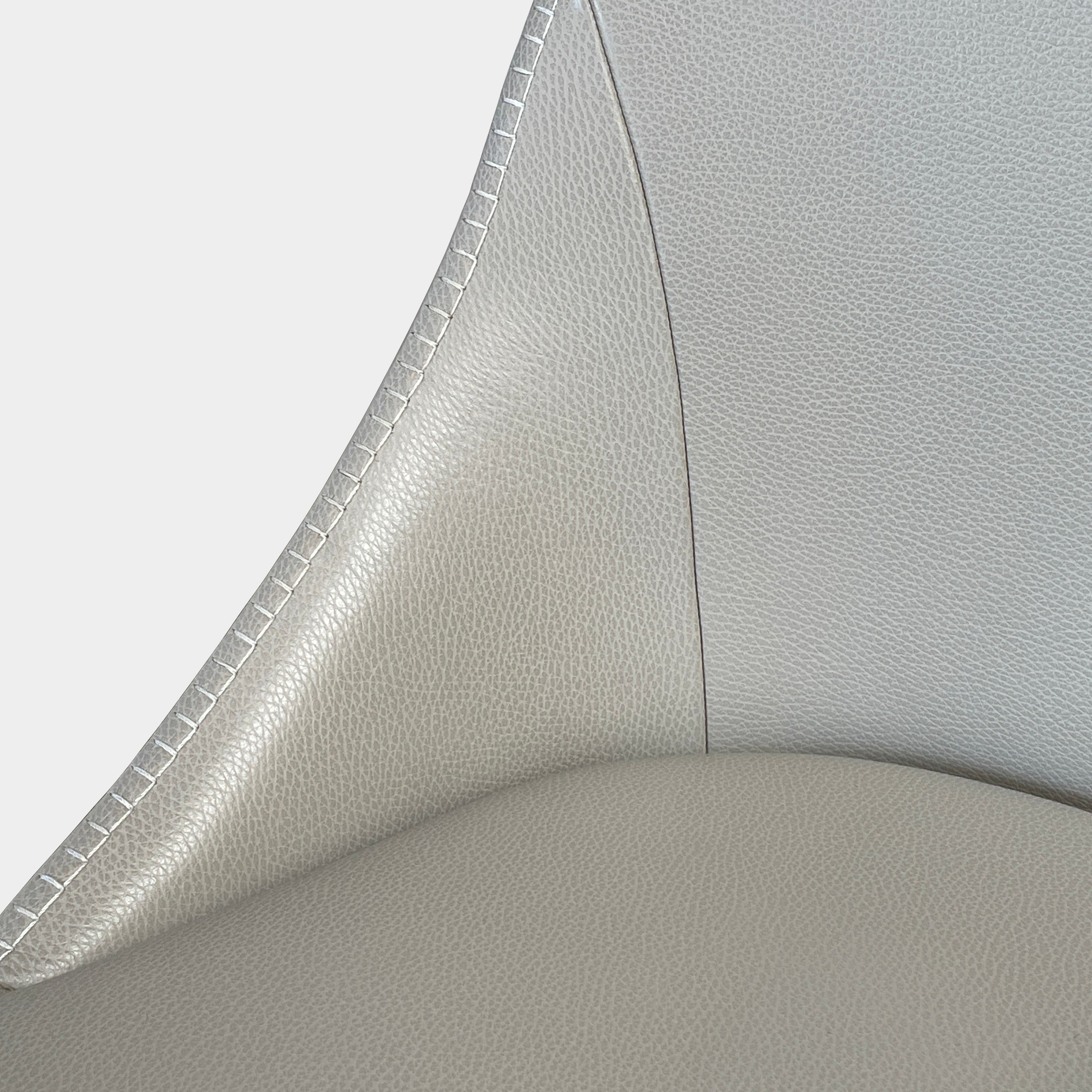 Two modern light gray Maxalto Febo high back dining chairs, embodying Italian design, against a white background.