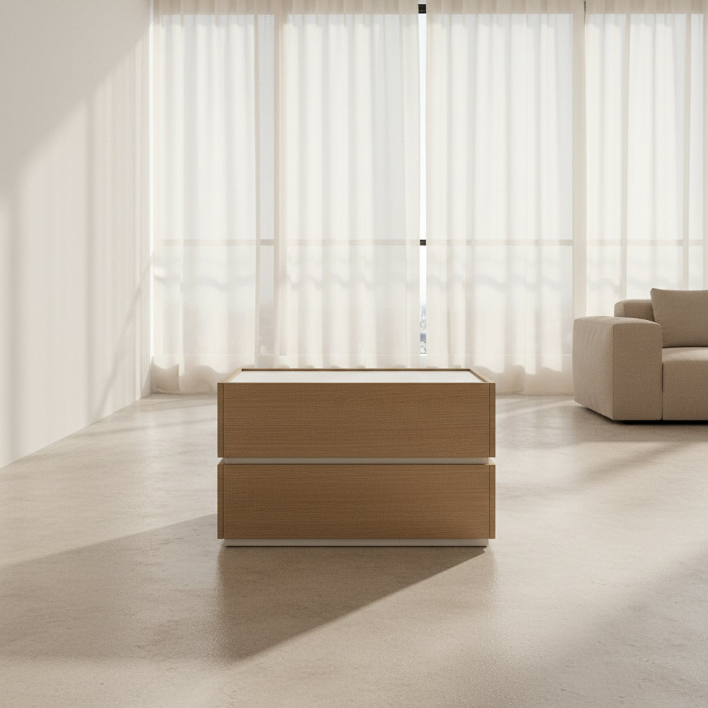 The Sangiacomo Cidori Small Chest of Drawers by Sangiacomo is ideal for contemporary spaces, featuring a light-toned top and single partially open drawer, set on a concrete floor against a white wall.