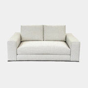 The Minotti Hamilton Love Seat 71" by Minotti, in light gray with two seat and two backrest cushions, is shown against a plain white background.
