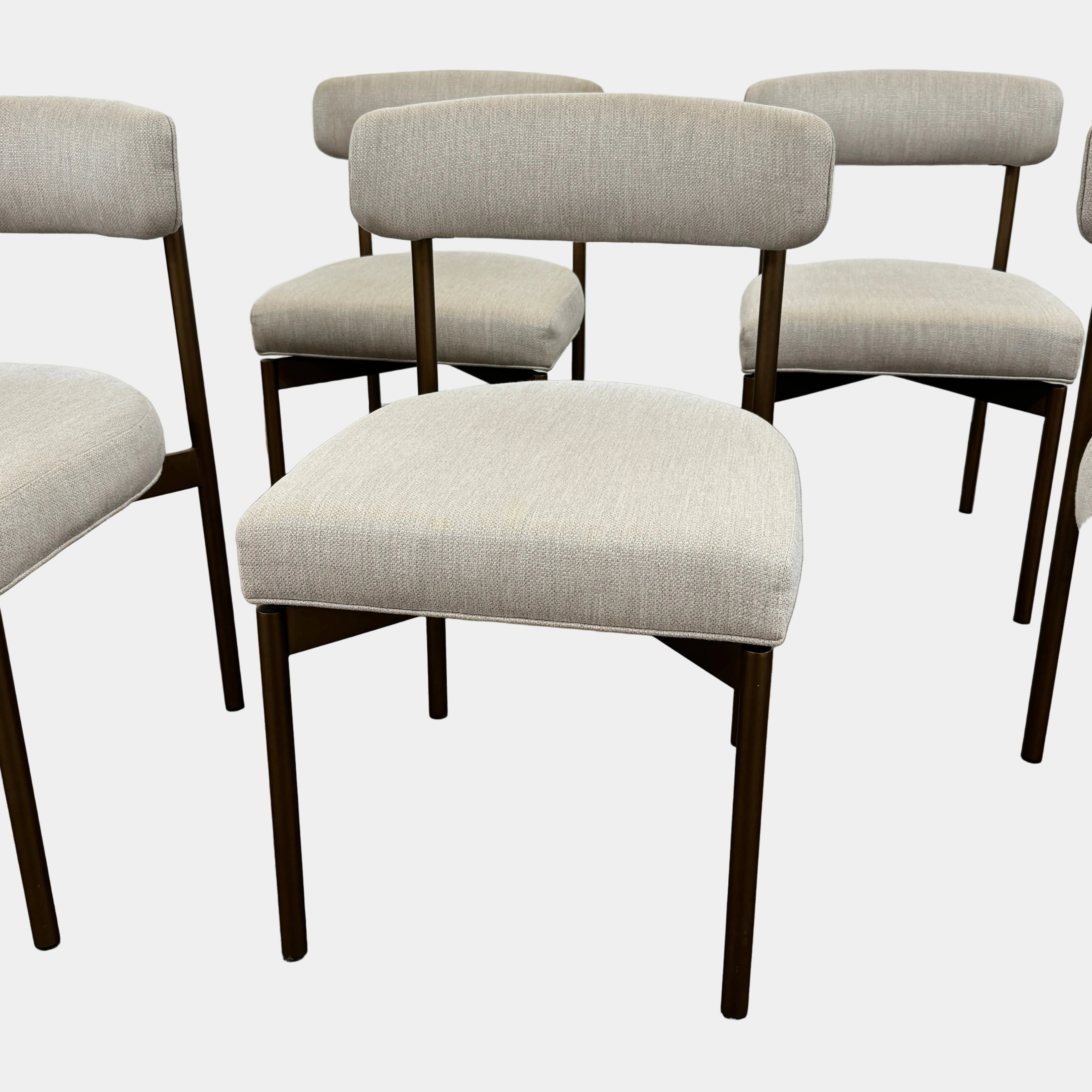 Five Mitchell Gold + Bob Williams Remy dining chairs, upholstered in high-performance fabric with dark metal legs, are arranged in two rows on a plain white background.