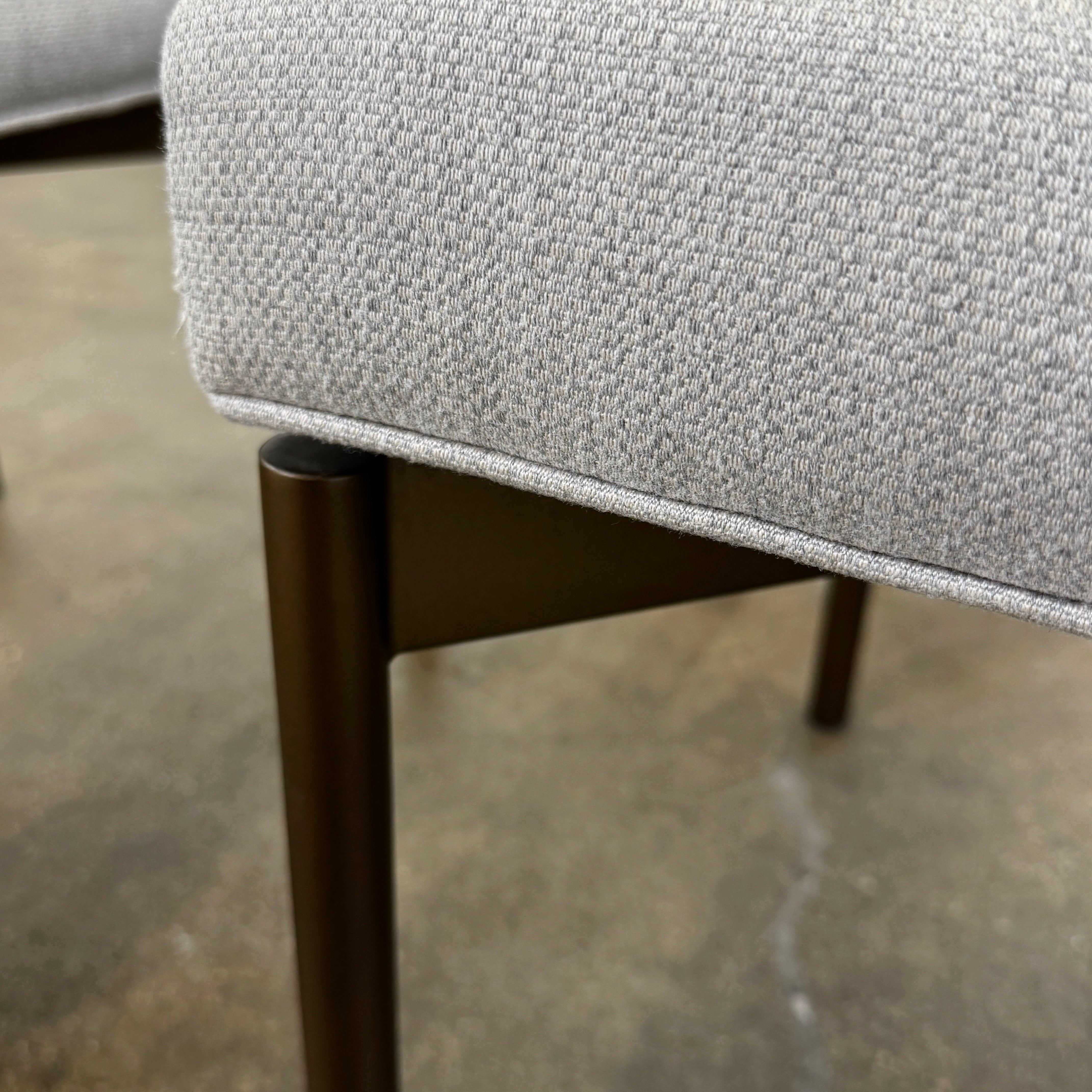 Five Mitchell Gold + Bob Williams Remy dining chairs, upholstered in high-performance fabric with dark metal legs, are arranged in two rows on a plain white background.