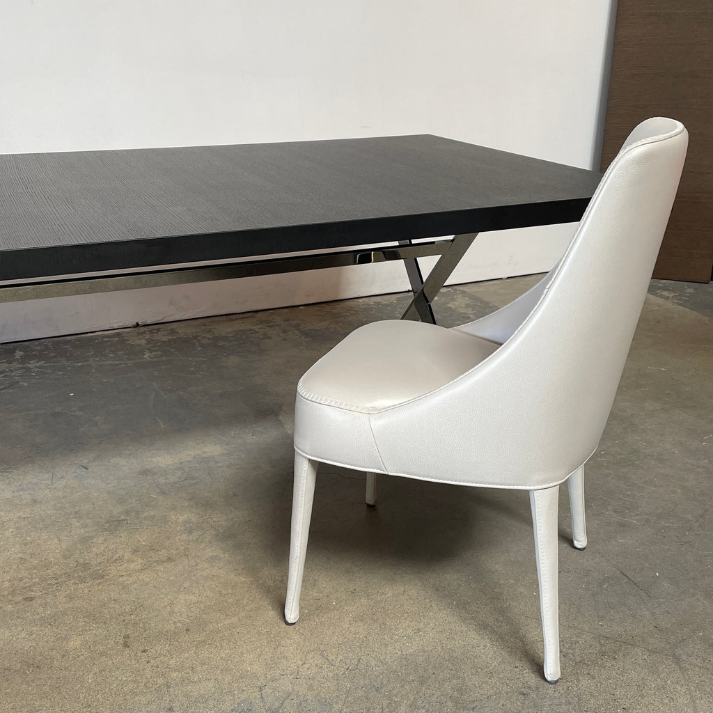 Two modern light gray Maxalto Febo high back dining chairs, embodying Italian design, against a white background.