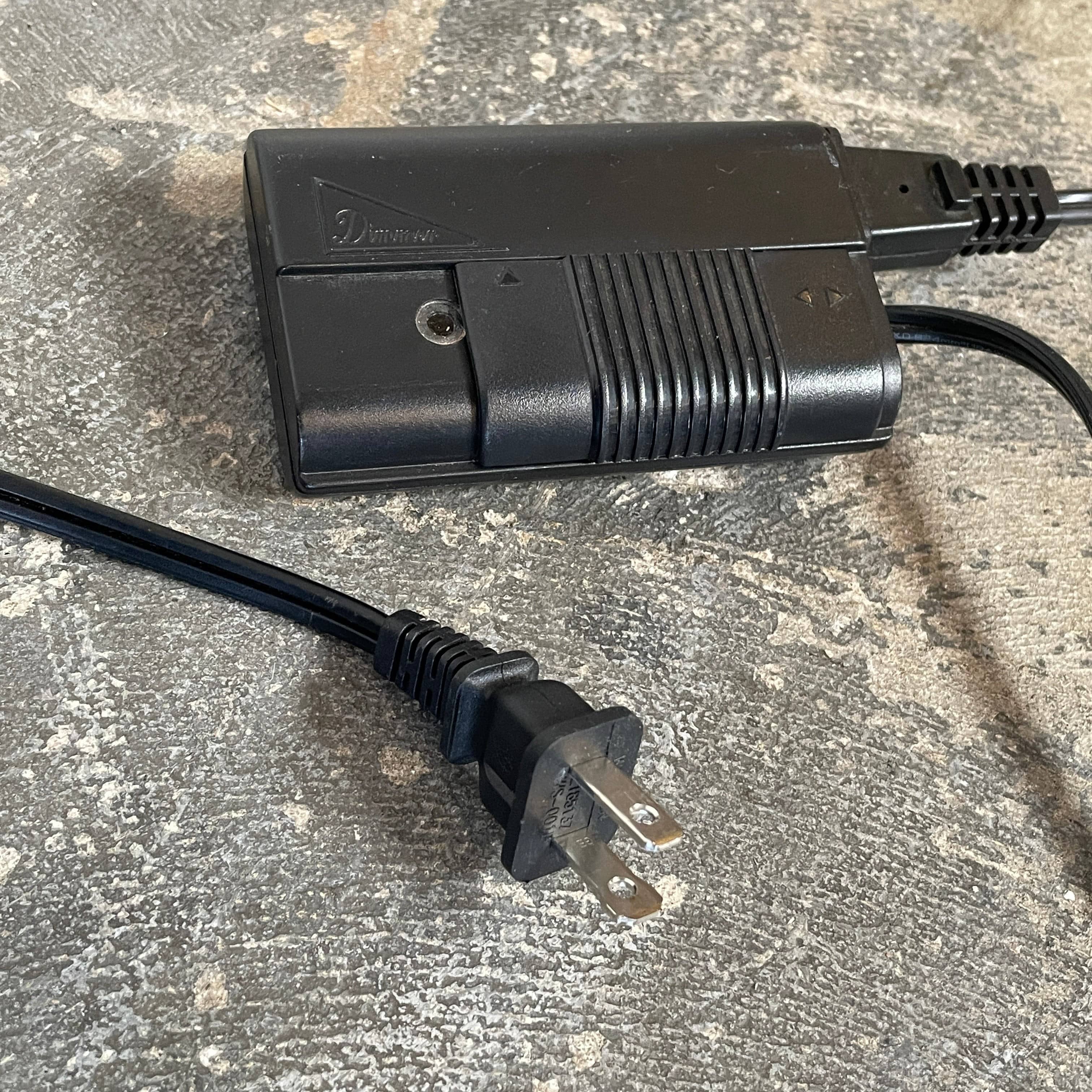 A modern Flos Spun Floor Light with a spun aluminum frame and a white base and shade.