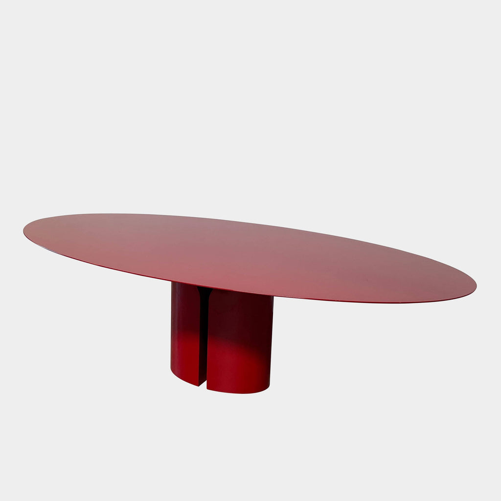 A red oval MDF Italia NVL dining table on a white background.