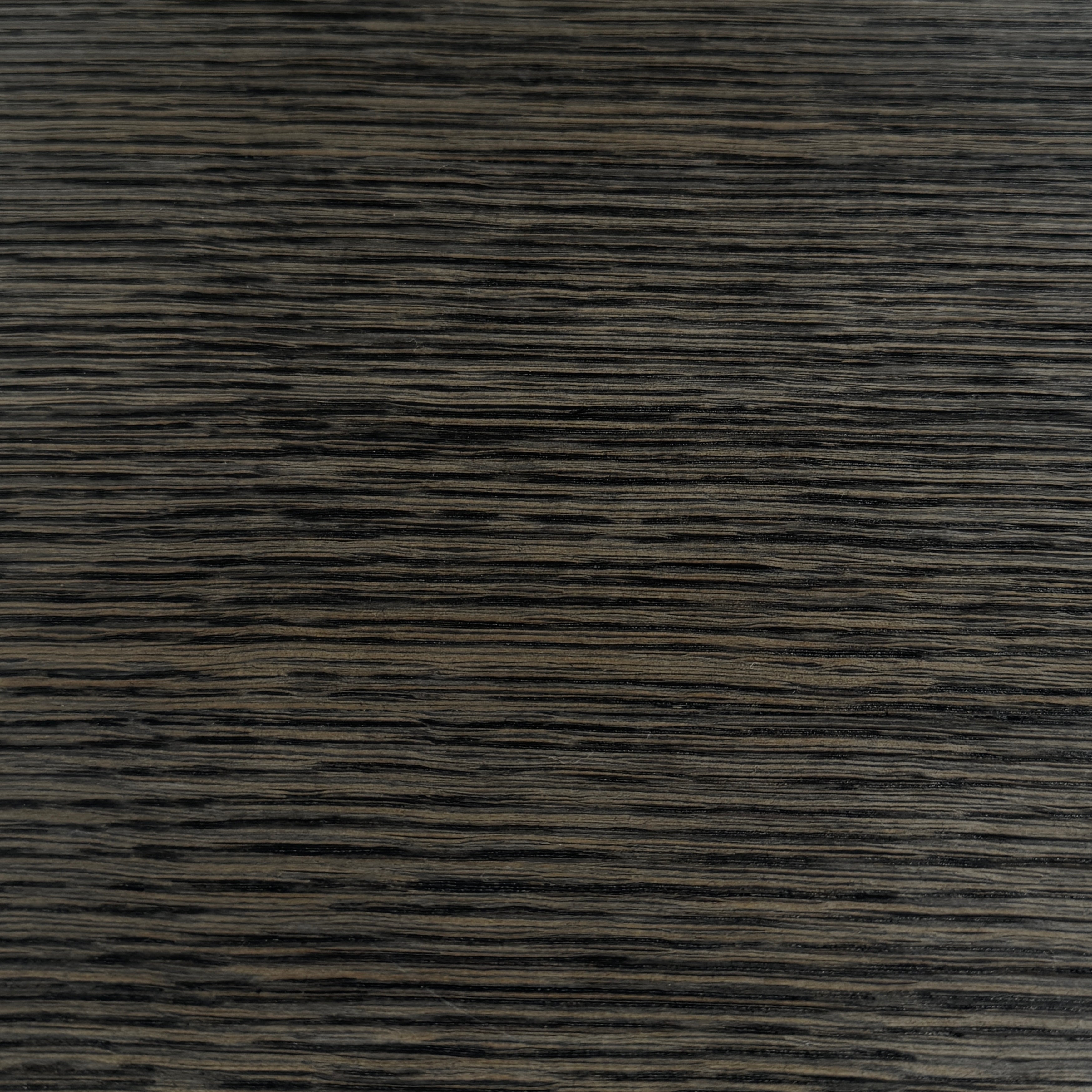 The Maxalto Max Table Grey Oak by Maxalto features a grey oak wooden top, metal legs, and an angular modern design—ideal for enhancing any dining space. Displayed on a plain white background.