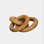 The Artist Sofi Ceramics Carved Rings feature two interlocking brown wooden rings with varied textures, evocative of ceramic artistry, shown on a plain white background.