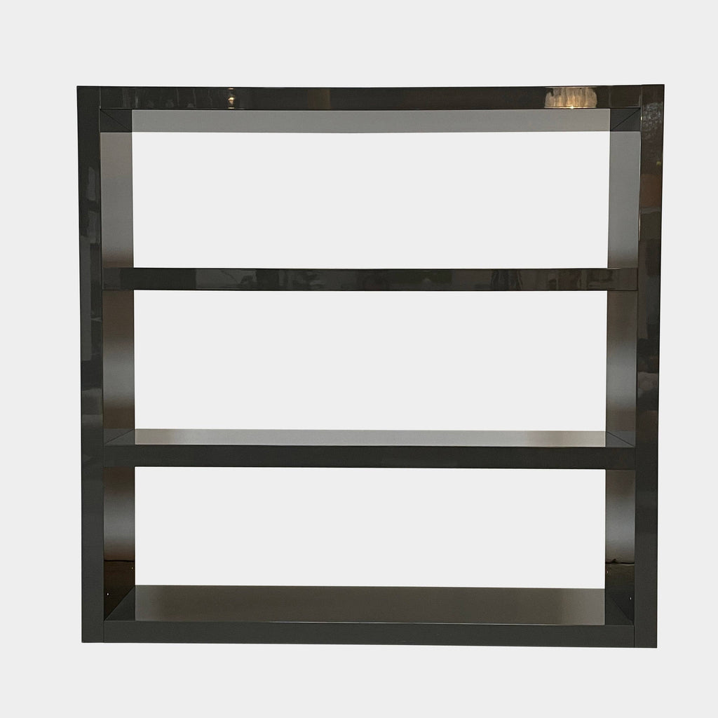 A black Minotti Johns Bookcase with three shelves on it.