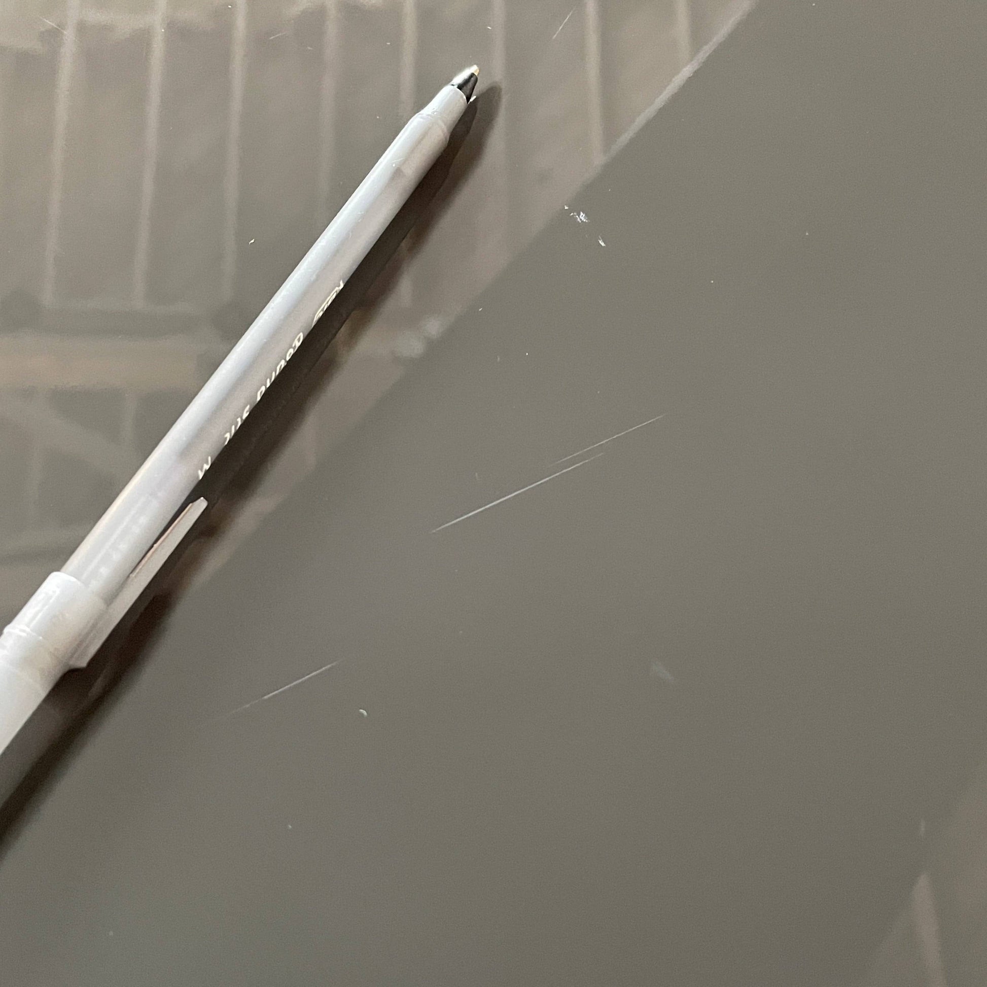 A black Minotti Johns Bookcase with three shelves on it.