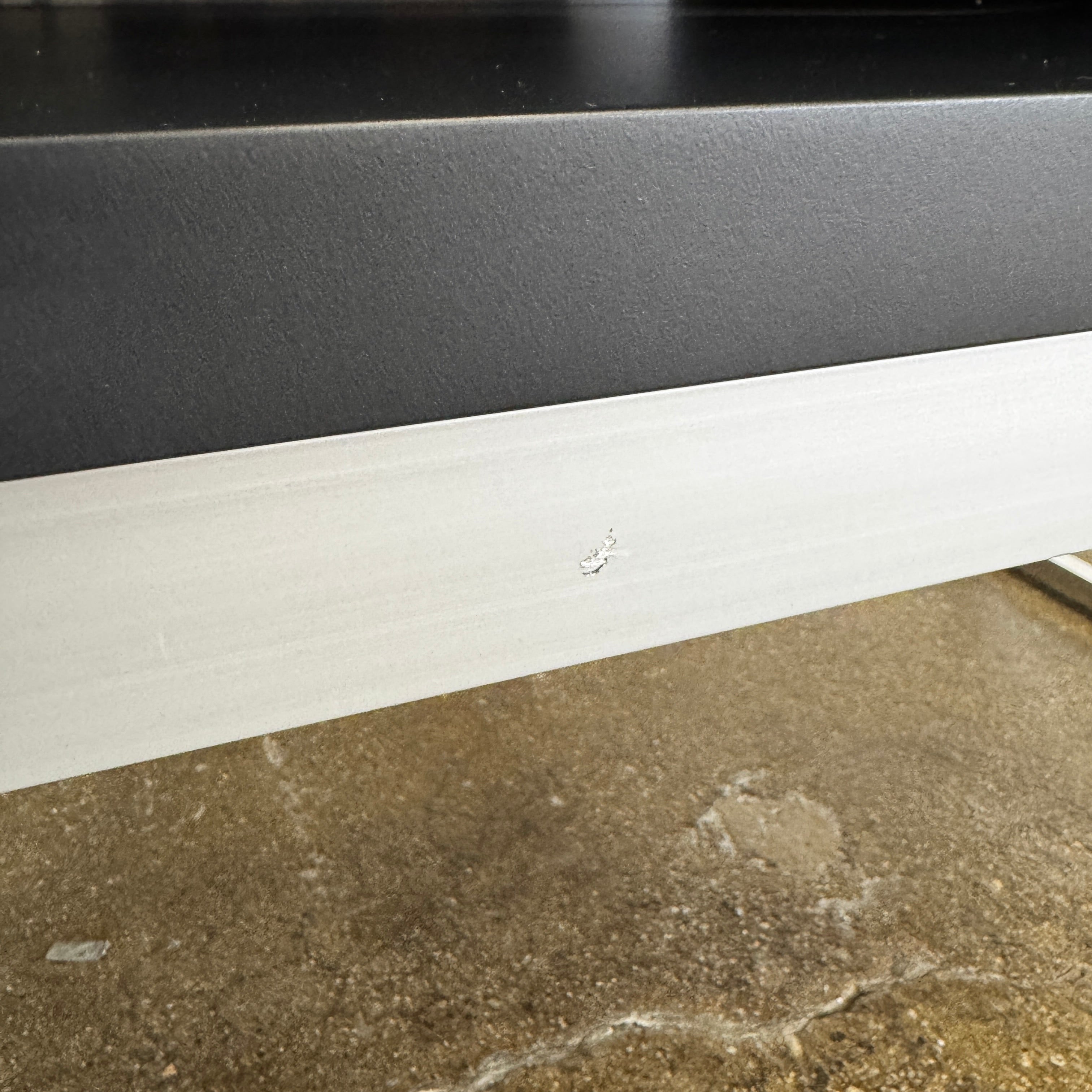 The B&B Italia Athos Console features a modern black rectangular design with a glossy finish and metal legs, showcased against a plain white background.