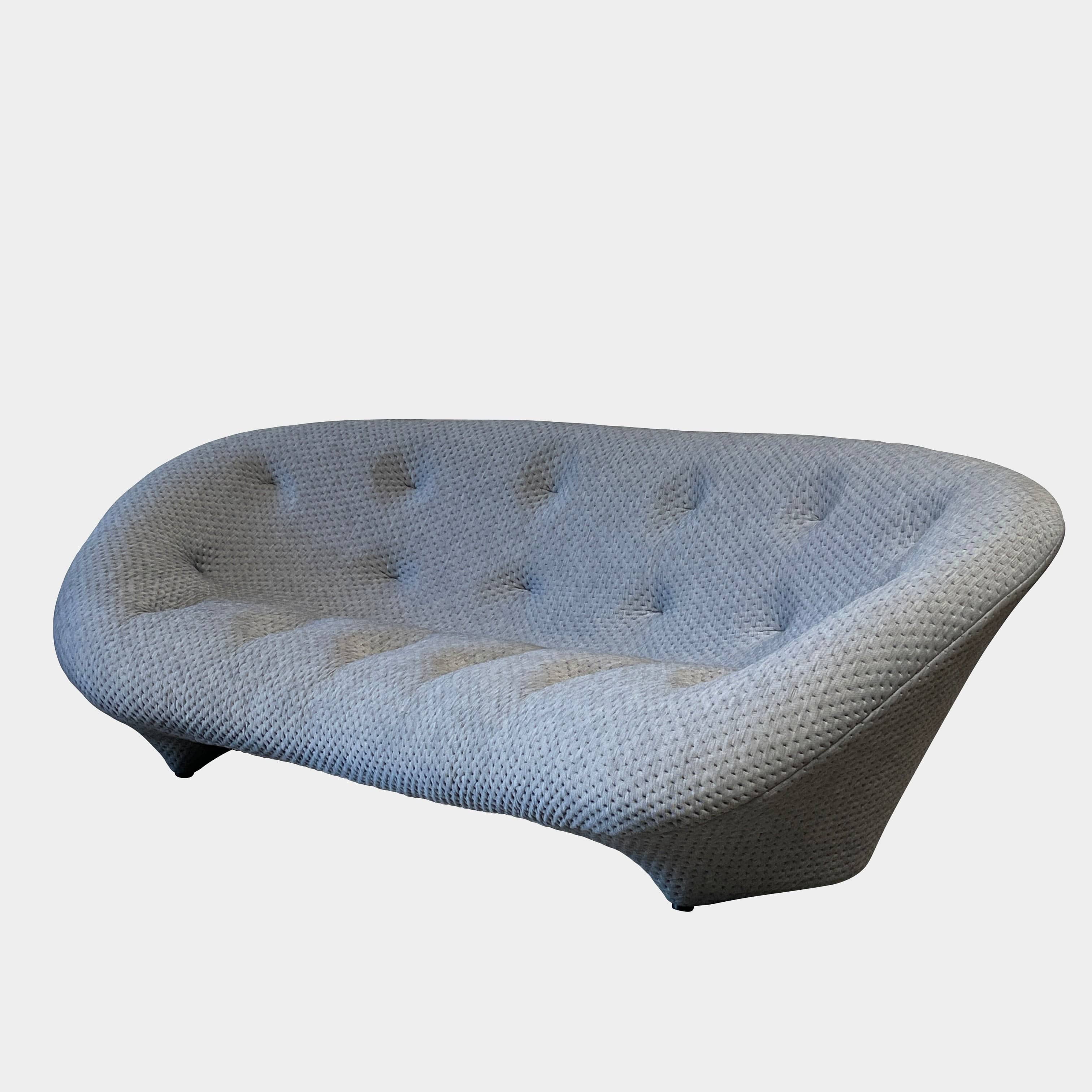 Modern tufted Ligne Roset Ploum sofa isolated against a white background.