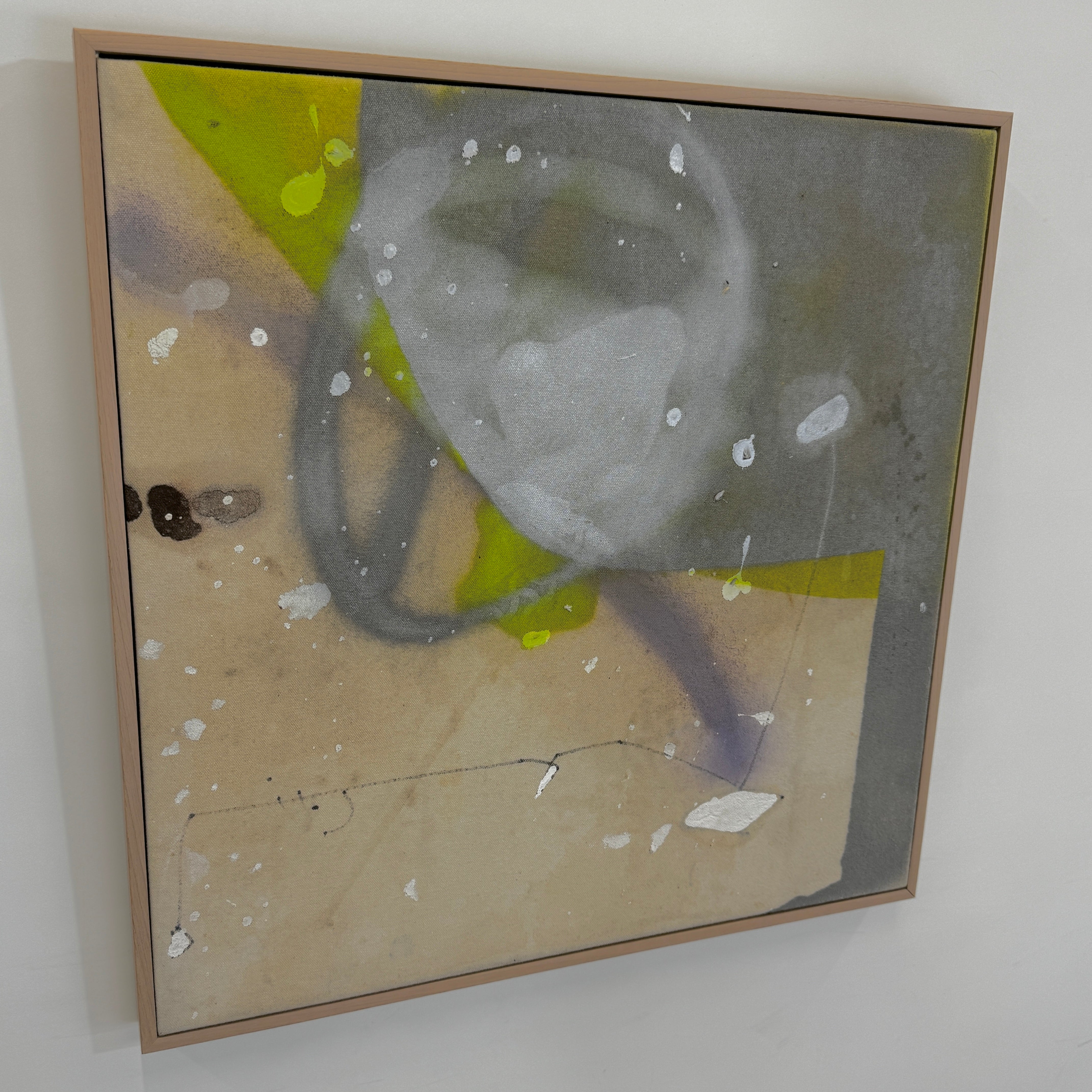 Framed Painting: Allison Caesar Mixed Media - Untitled by Artist features gray, beige, and yellow with circular forms, splatters, and dark spots on a textured background. This elegant artwork enhances any space.