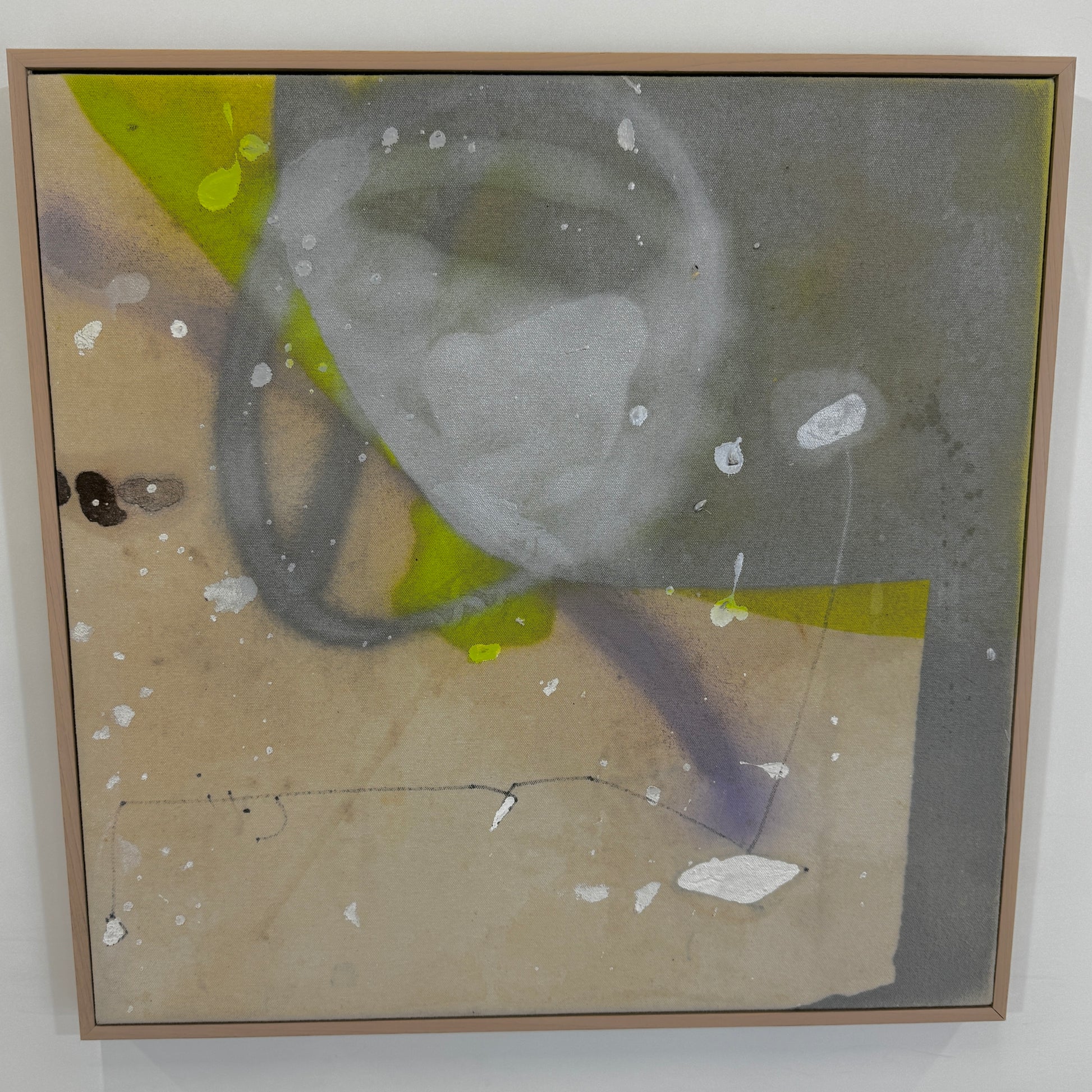 Framed Painting: Allison Caesar Mixed Media - Untitled by Artist features gray, beige, and yellow with circular forms, splatters, and dark spots on a textured background. This elegant artwork enhances any space.