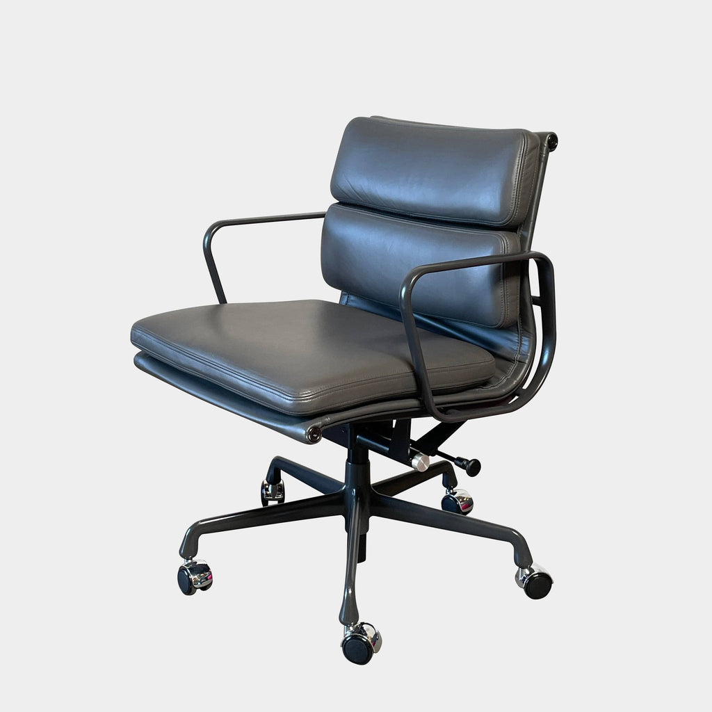 Adjustable Eames Management Soft Pad office chair with black casters and blue upholstery.